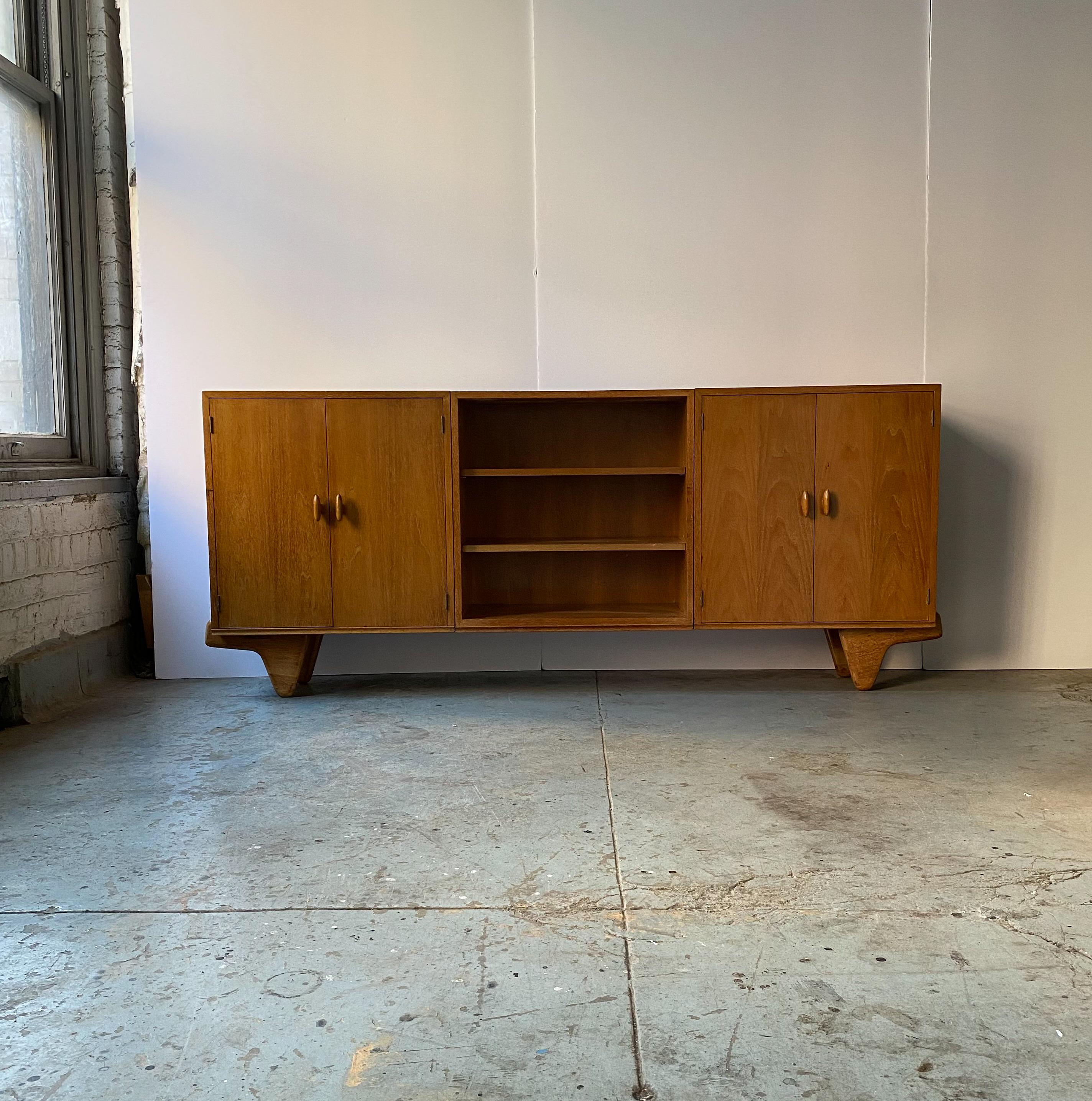 Modular unit cabinet in silvered walnut by the team of German-born American architects Oscar Stonorov and Willo von Moltke, designed for the Museum of Modern Art's 1941 Organic Design in Home Furnishings competition, and produced in very small