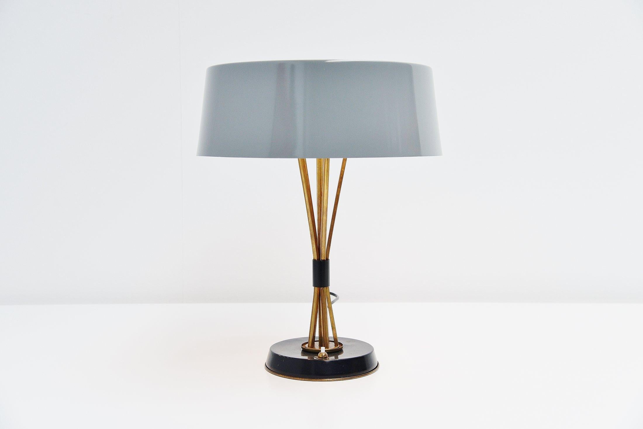 Very nice tiltable table lamp designed by Oscar Torlasco and manufactured by Lumi, Italy, 1960. This lamp has many beautiful hidden details and quality is written all over. Torlasco was for me the master of surprises, when a lamp looks simple, it
