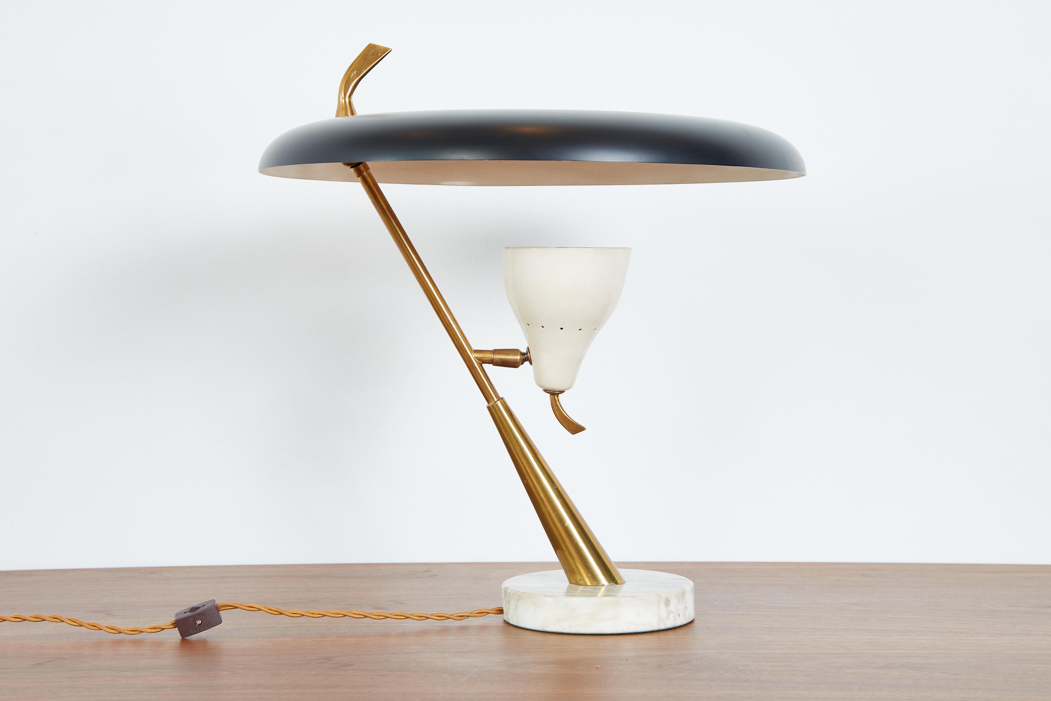 Handsome table lamp with diffused shade and pivoting perforated cone with brass hardware. 
Lumen, Milano production 
Attributed to Oscar Torlasco 
Italy, 1950s 
Newly rewired 