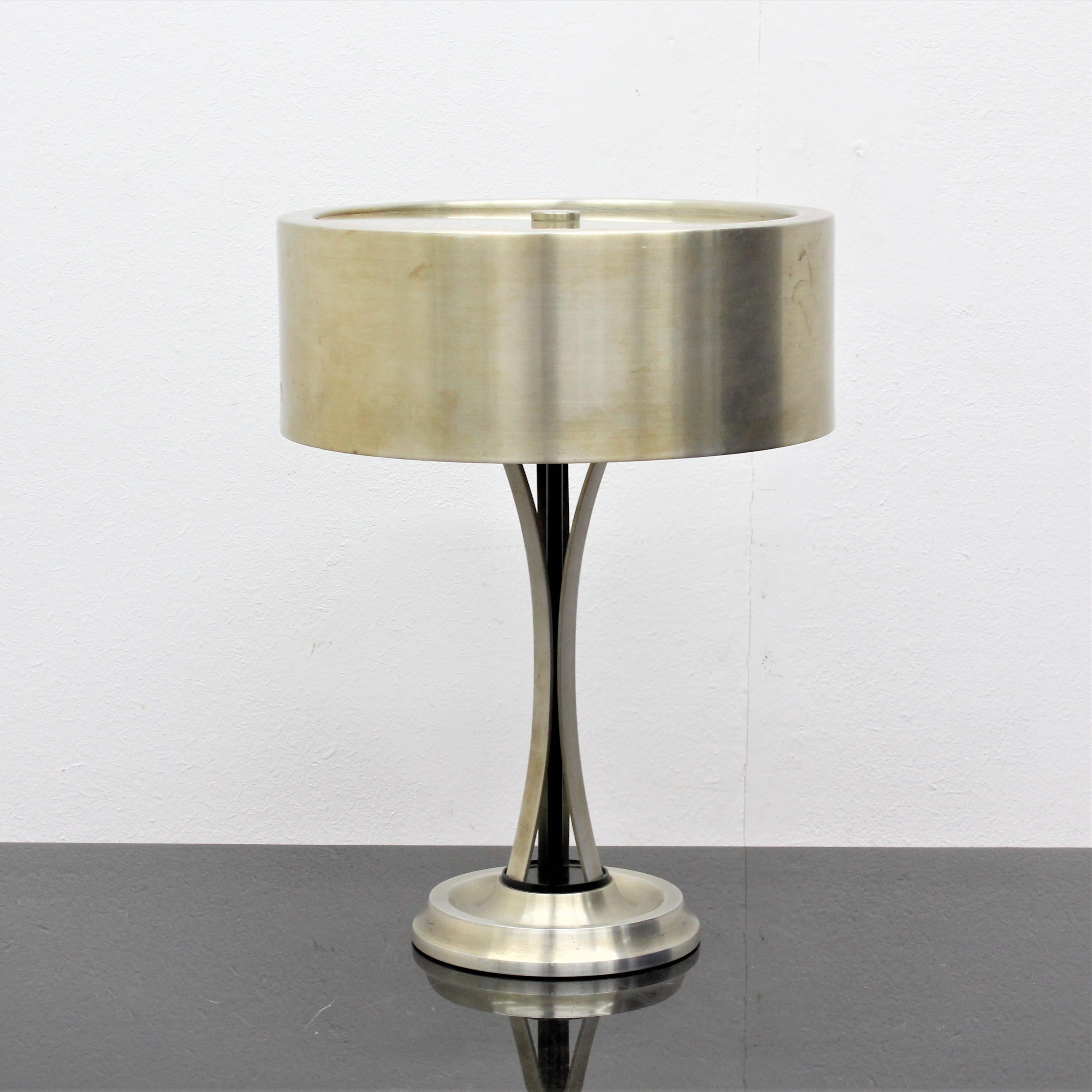 Elegant table lamp with three lights, in steel with adjustable lampshade. Mod. 790 designed by Oscar Torlasco for Lumi Milan. An iconic piece of 1950s Italian design.
Wear consistent with age and use.
 