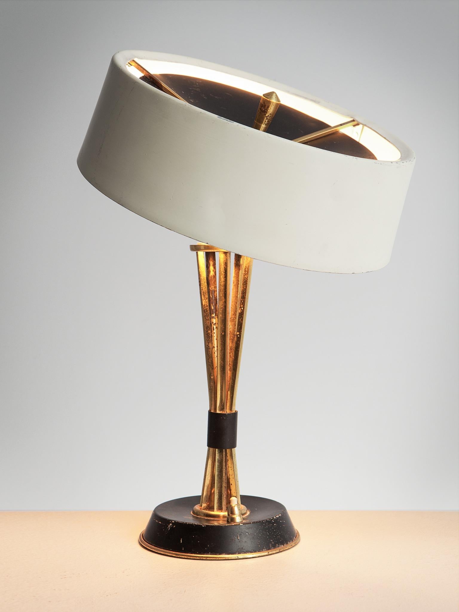 Oscar Torlasco for Lumi Milano, table light in brass and aluminum, Italy, 1960s.

This Italian table lamp is designed by Oscar Torlasco for Lumi
Milano. The stem is executed patinated brass that exists of several square stems that that sprout