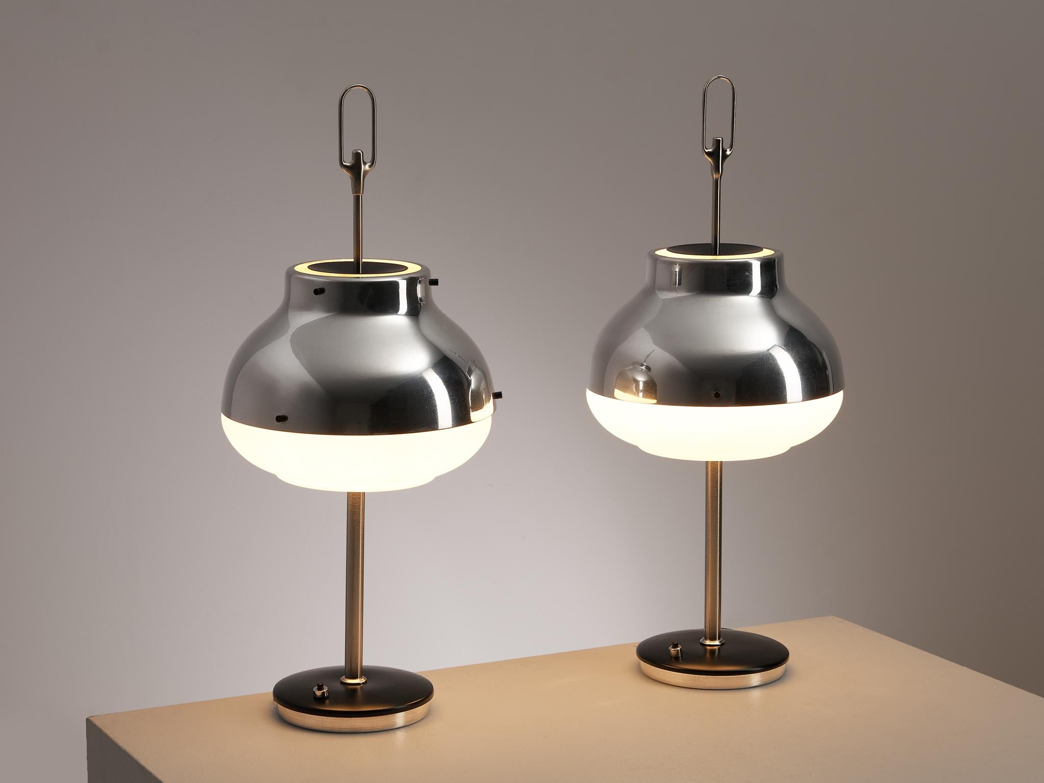 Oscar Torlasco for Lumi, table lamps, model 648, brushed aluminum, opaline glass, Italy, 1960s

Wonderful table lamps designed by Oscar Torlasco for Lumi Milano. Torlasco, who created many innovative lighting designs for Lumi, made this lamp in