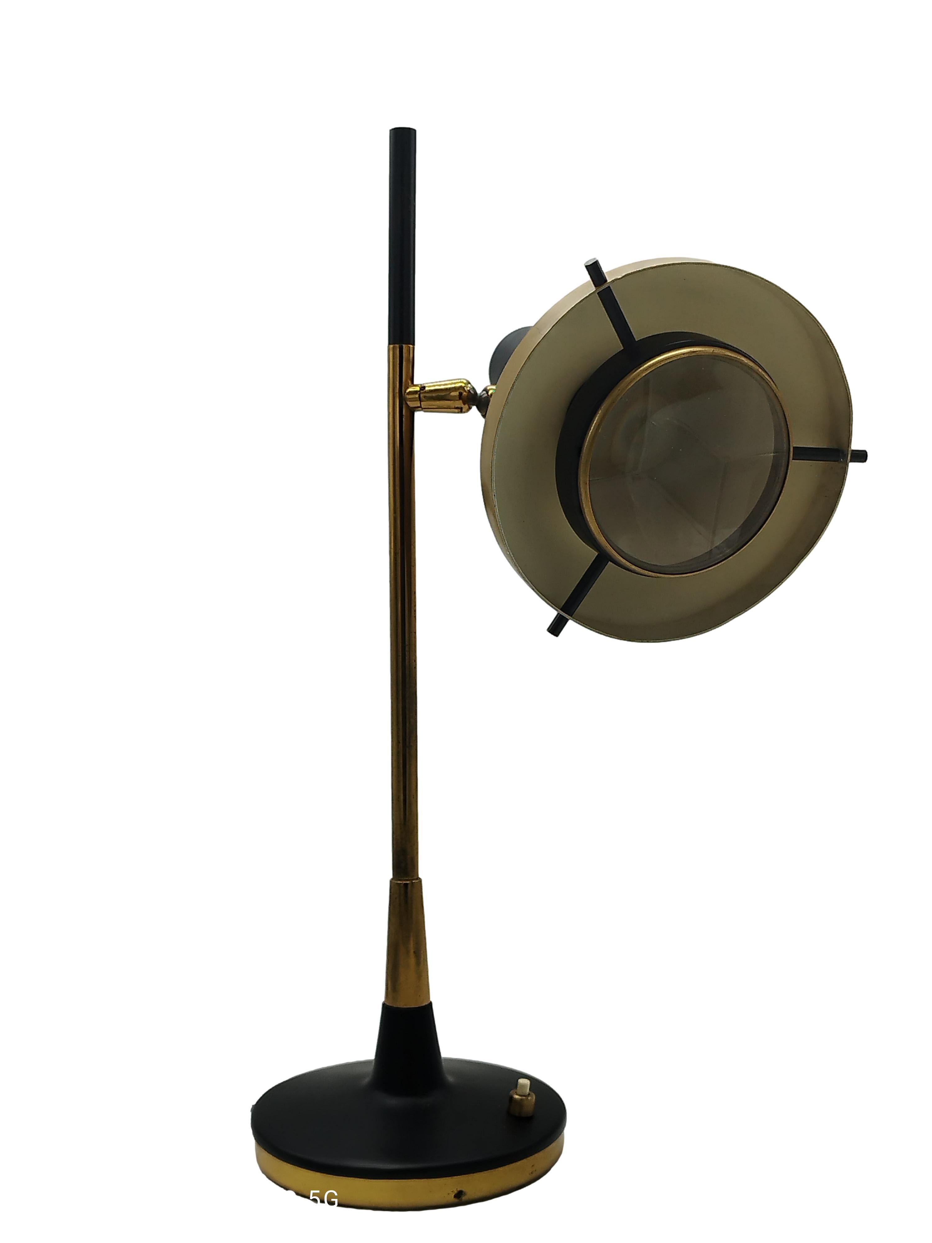 Oscar Torlasco mod. 553 table lamp. Large version.
Manufactured by Lumi, Milan, Italy, late 1950s
Painted brass and aluminium. Glass optical lens. 