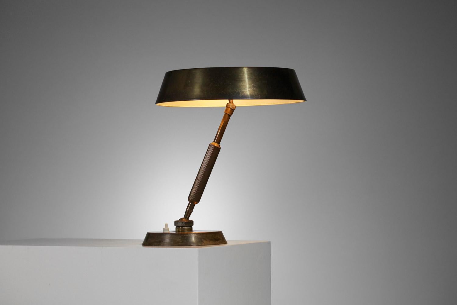 Beautiful desk lamp from the 60's by Italian designer Oscar Torlasco. Structure and shade in solid brass, possibility to orient the lamp in different directions thanks to a central ball joint as well as the shade. Nice vintage condition, with a nice