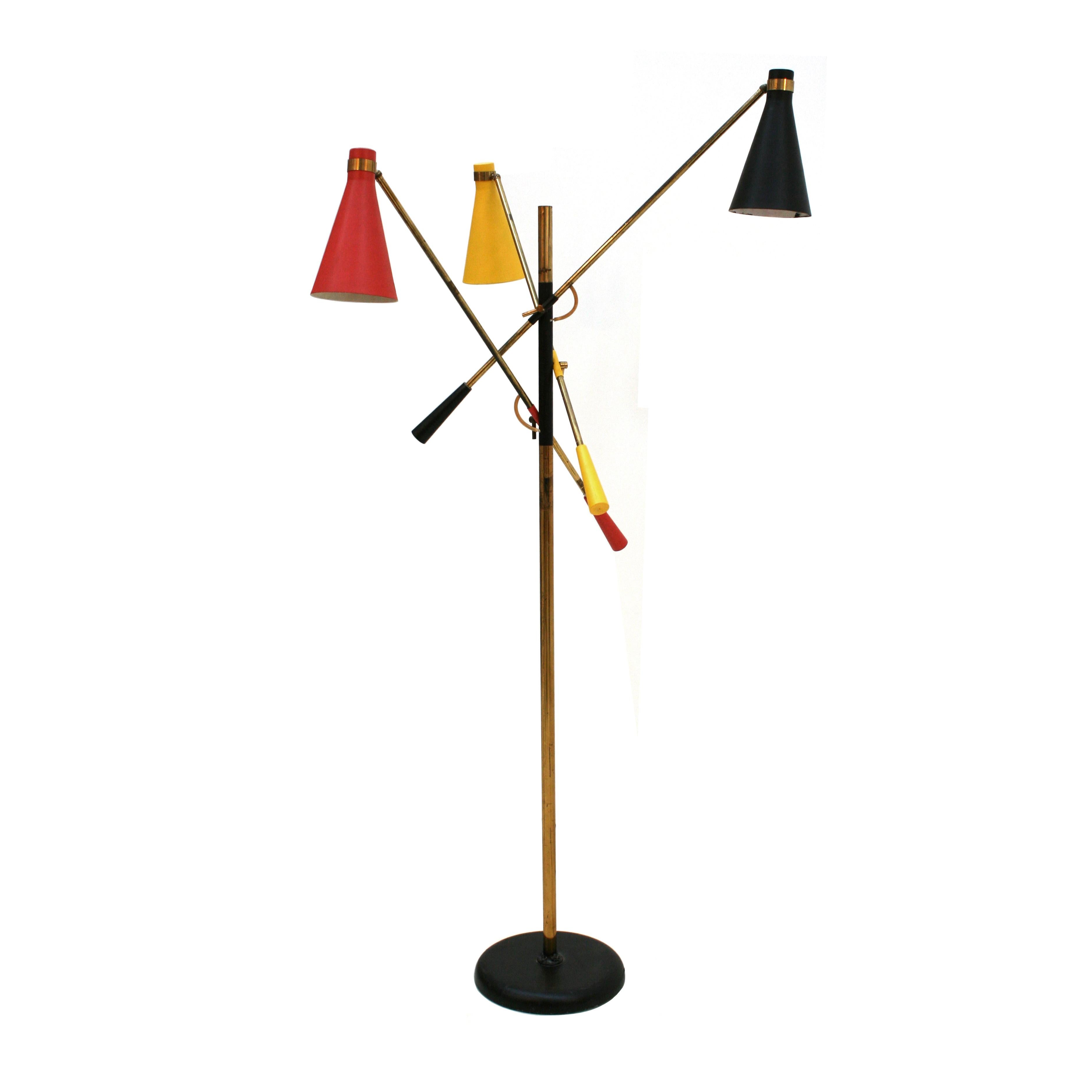 Floor lamp designed by Oscar Torlasco (1934-2004). Structure made of brass composed of three arms and adjustable colored cups.

Oscar Torlasco was an Italian lighting designer who worked for Esperia, Stilkronen and Lumi.
His style ranged from