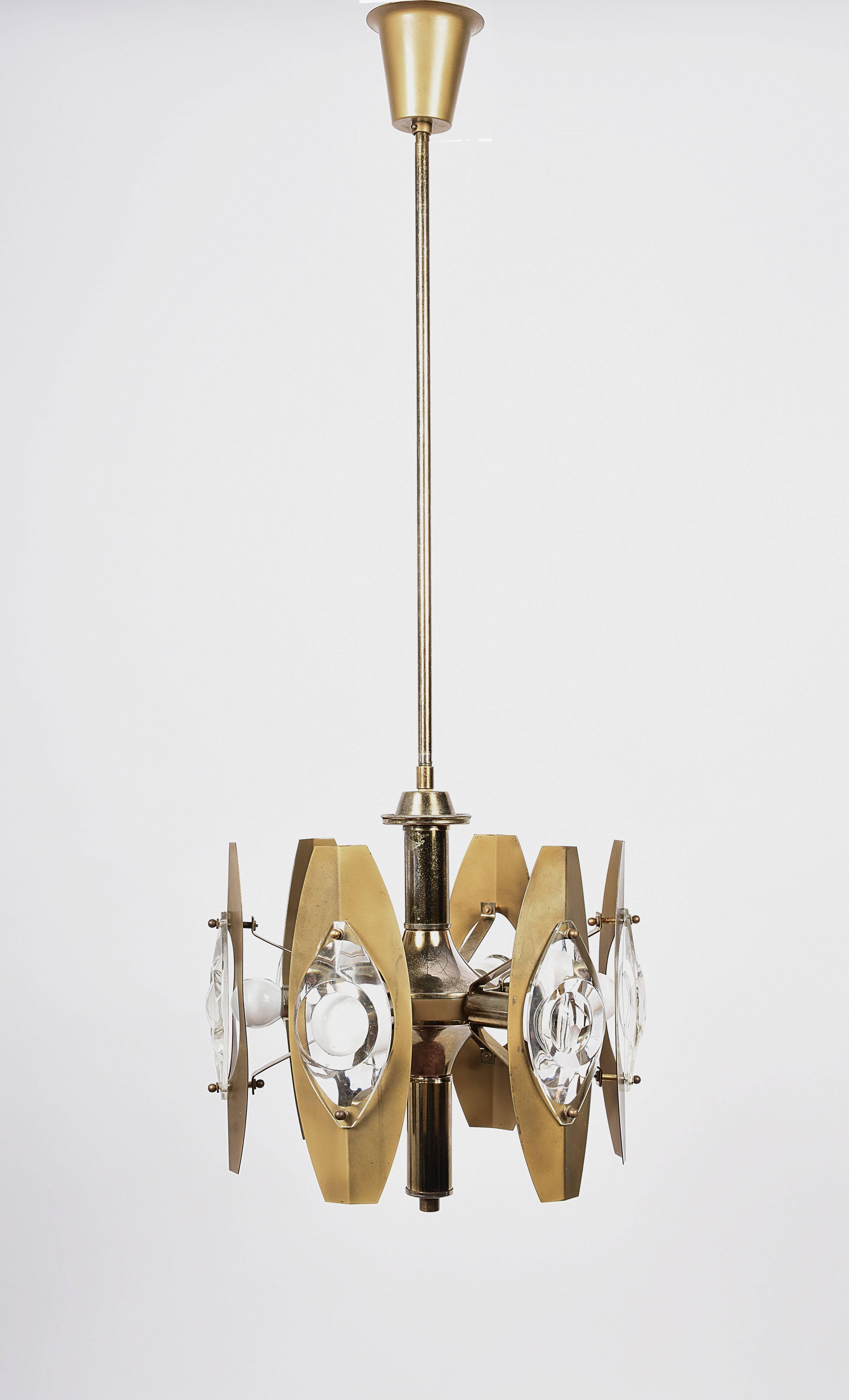 Wonderful Italian chandelier produced by Oscar Torlasco, manufactured in Italy during 1960s. 

This amazing chandelier has six polished gilded brass-framed arms which hold large glass lenses and sockets for small base bulbs or LEDs with maximum