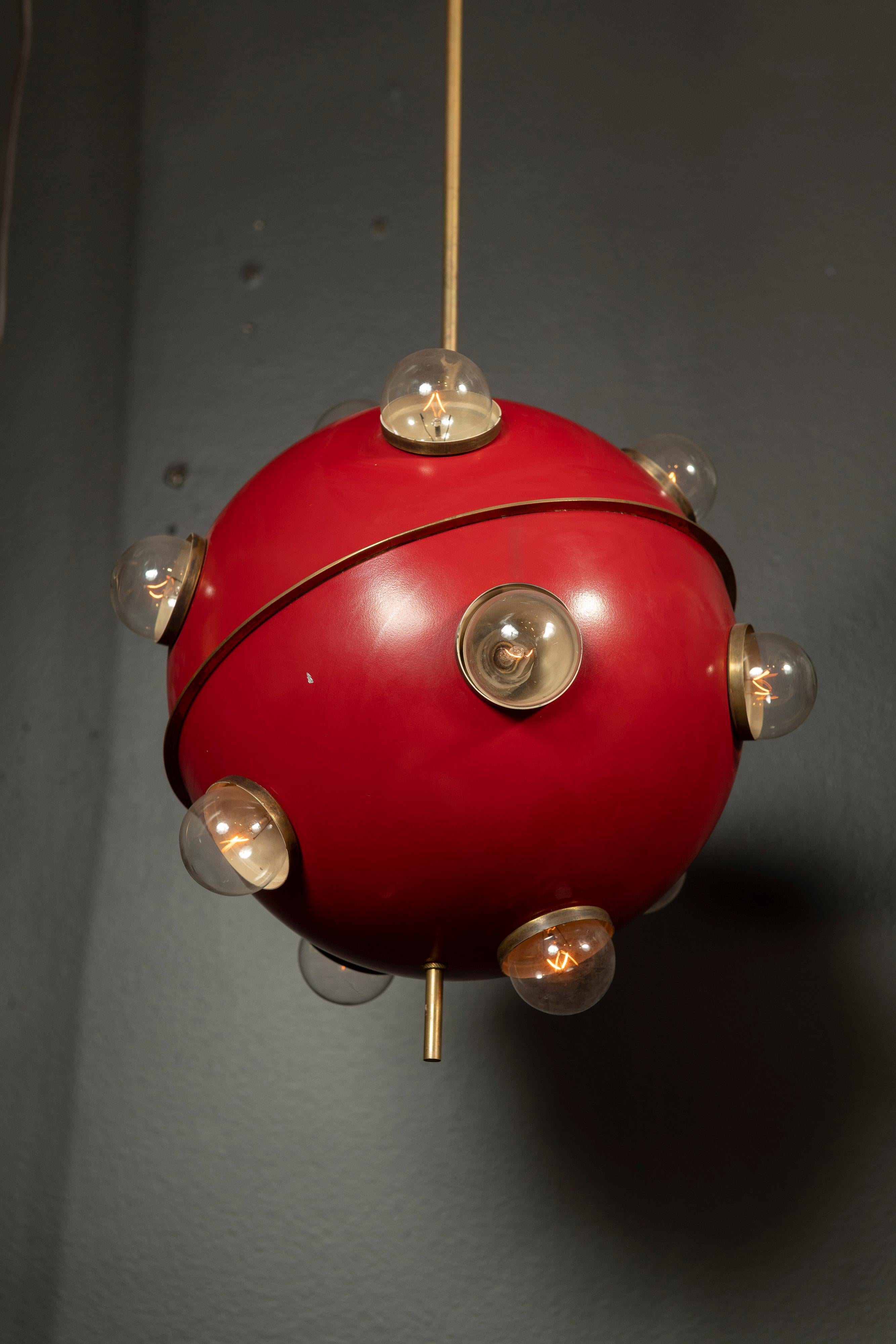 Our rare and desirable Oscar Torlasco, Suspension Pendant Model 553, is manufactured in Italy by Lumi. This light is sure to both enliven and light any space it inhabits. And the cherry red color - wow!