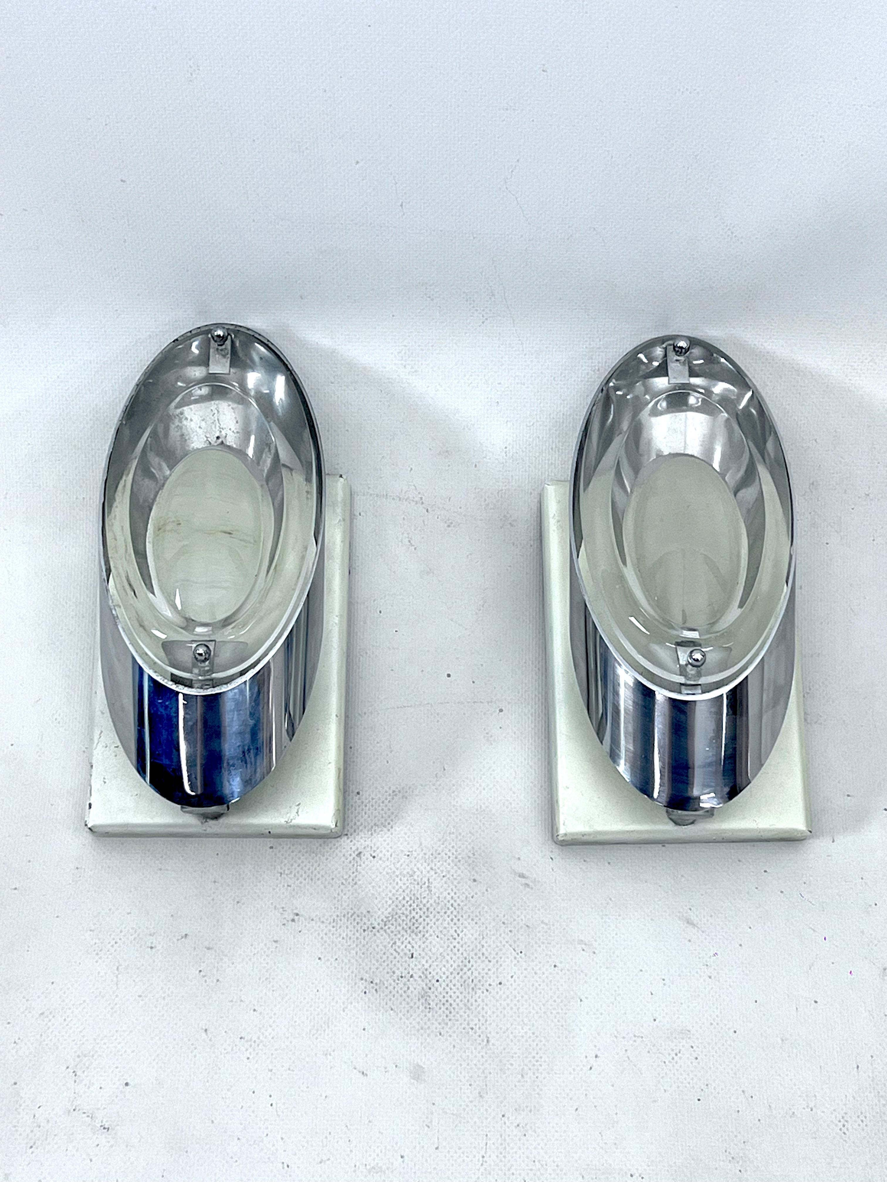 Set of two sconces designed by Oscar Torlasco for Stilkronen in fair vintage condition with normal trace of age and use but some oxidation on the white metal brackets. Chrome in good condition, glasses with no cracks. Full working with EU standard,