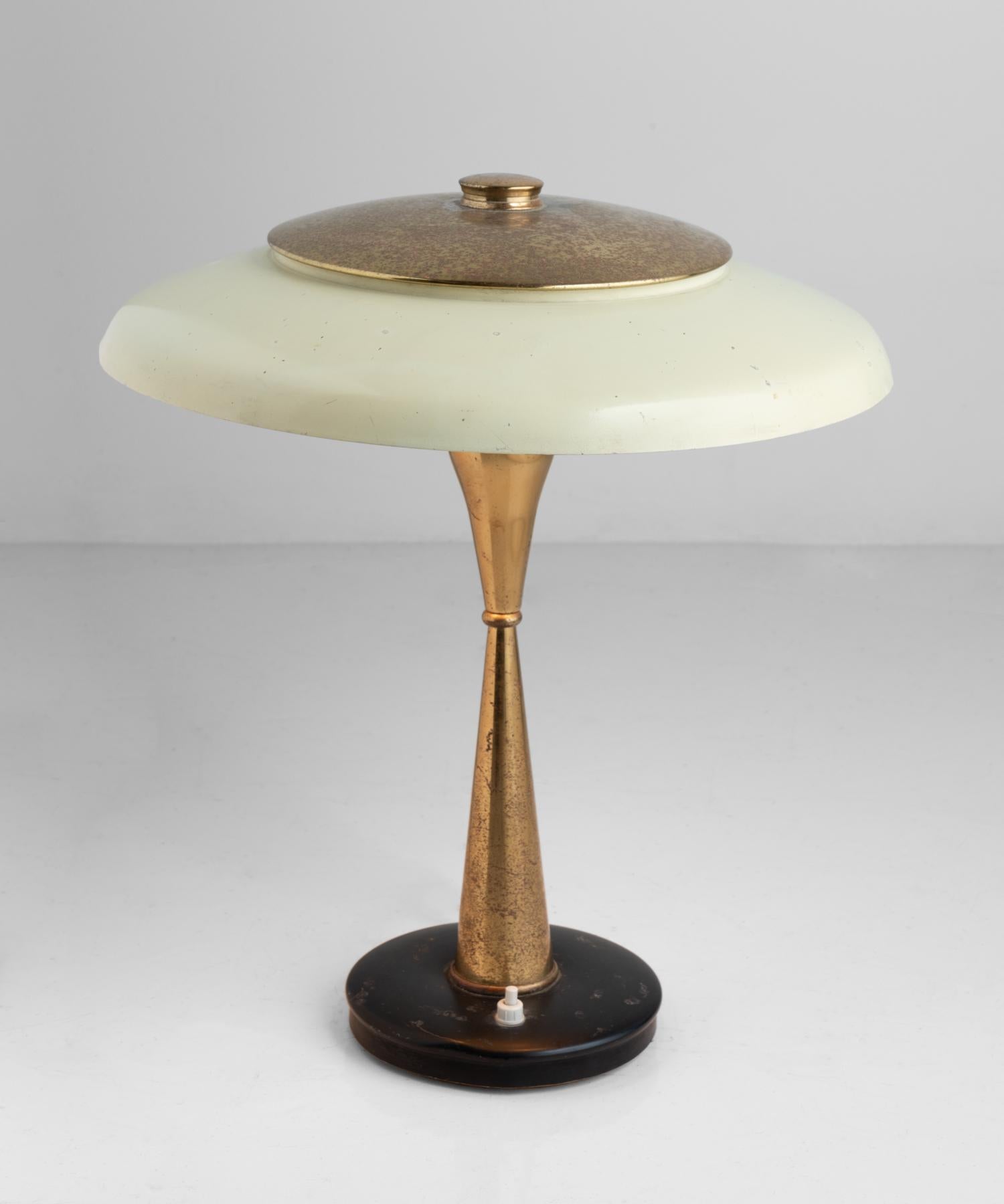 Oscar Torlasco Table Lamp, Italy circa 1950.

Designed by Oscar Tarlosco, Manufactured by Lumi. Made of brass and enameled metal, with articulating shade.