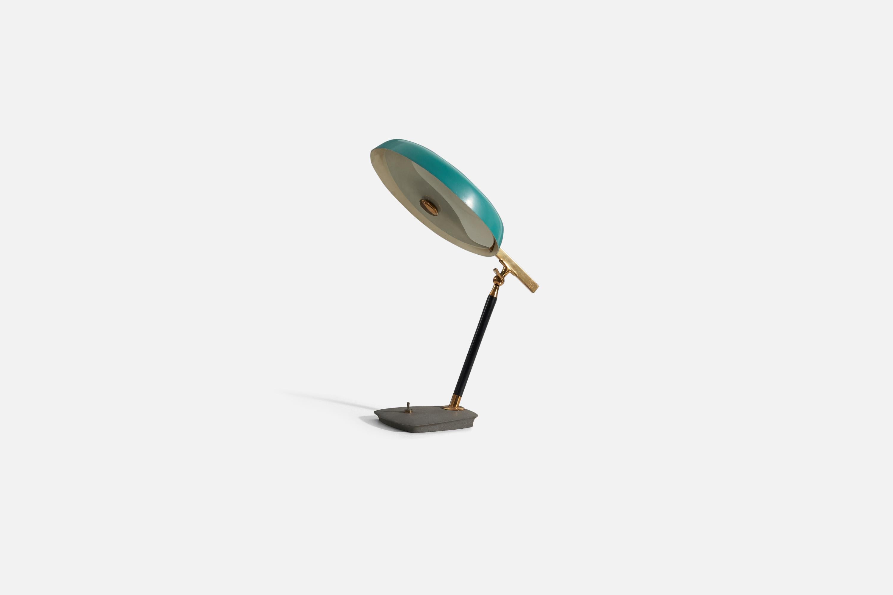 A blue-green lacquered metal, brass, and glass desk light / table lamp, designed by Oscar Torlasco, produced by Lumen Milano, Italy, 1950s. All original unrestored condition.
 
Measurements listed are as photographed in first image.