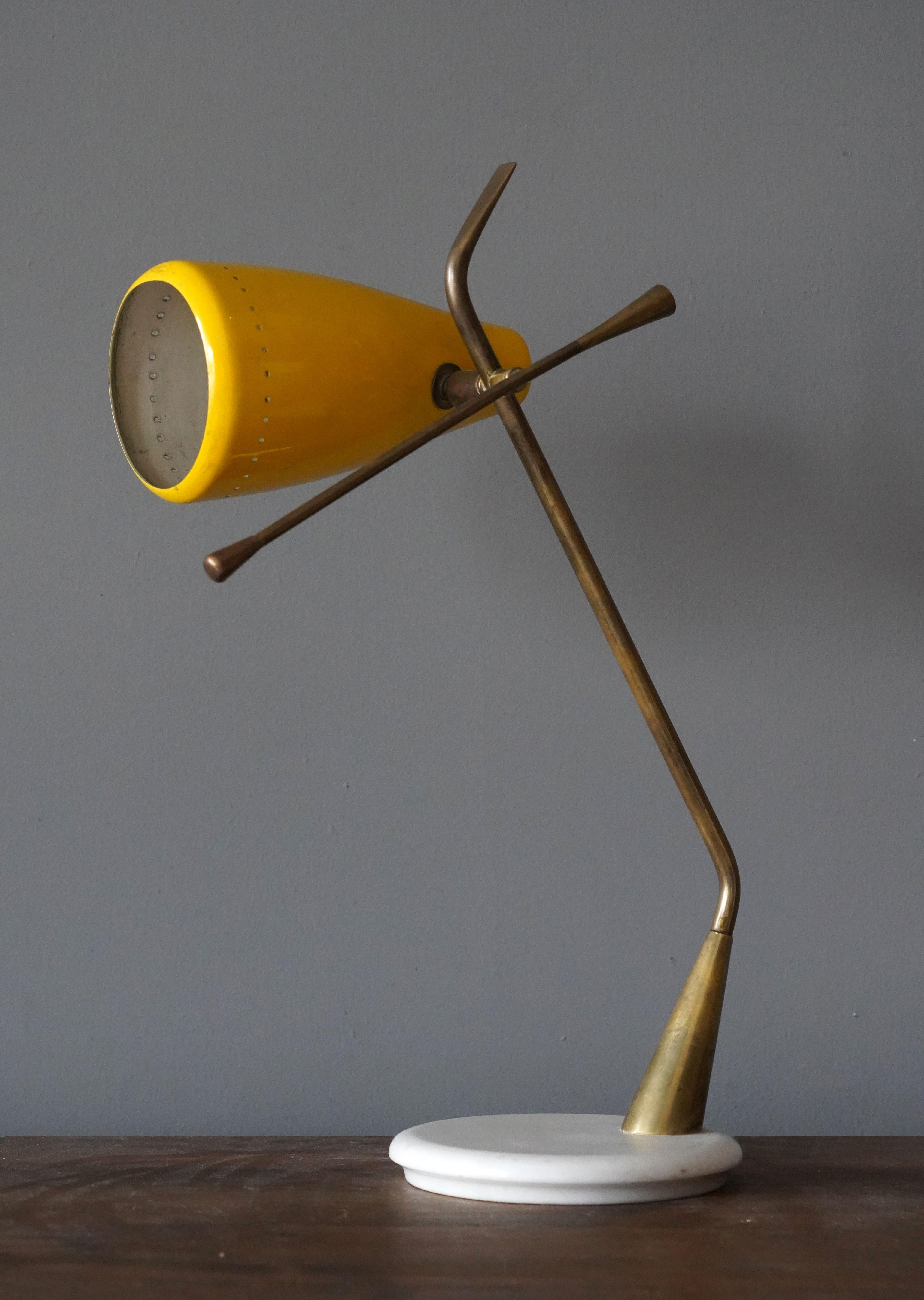 A rare desk light / table lamp. Designed by Oscar Torlasco, produced by Lumen Milano, Italy, 1950s.

Features yellow lacquered metal, brass, and marble.

Other designers and makers of the period include Angelo Lelii, Stilnovo, Max Ingrand,
