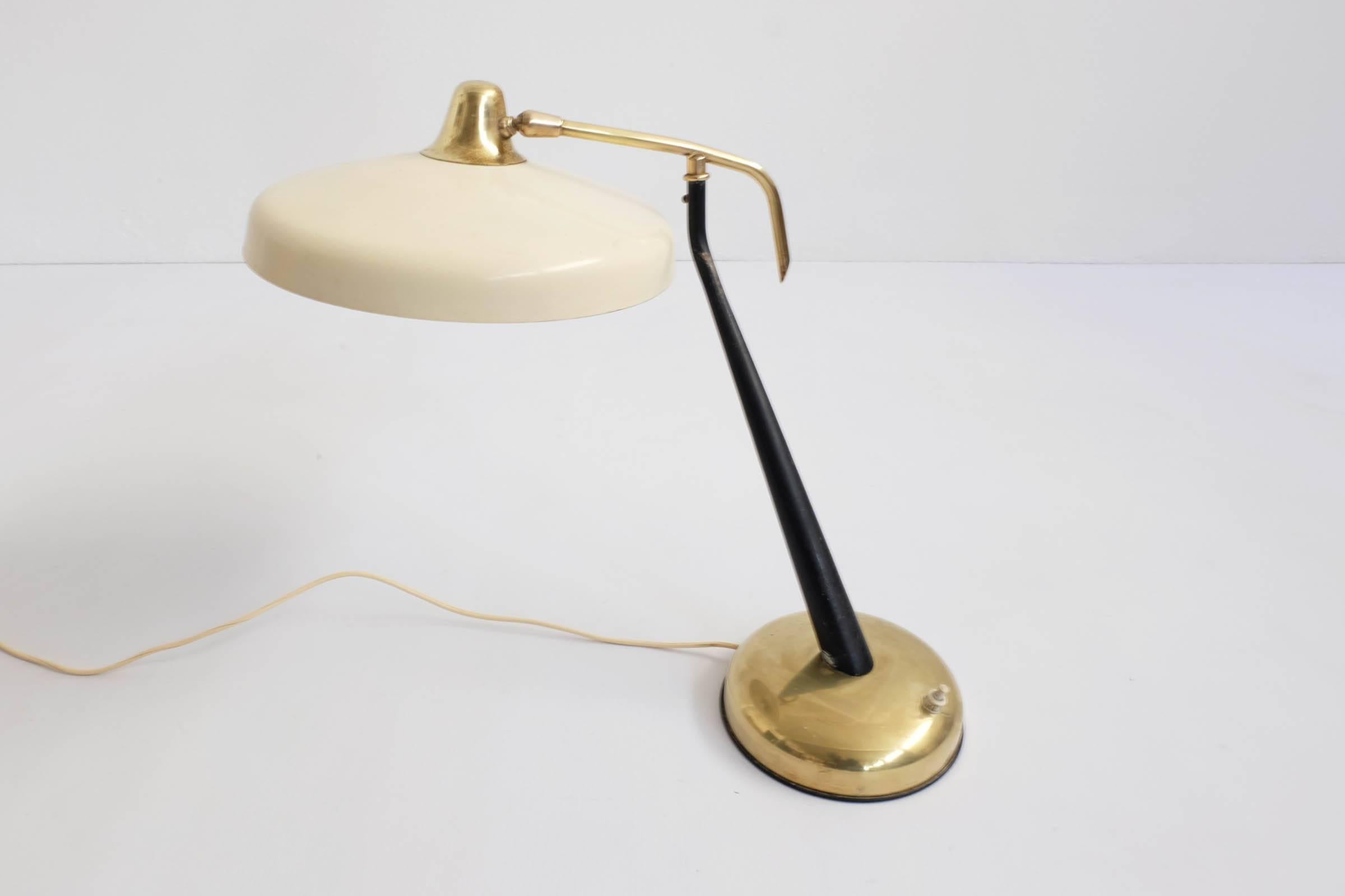 Beautiful adjustable table lamp totally revolving on the base.
