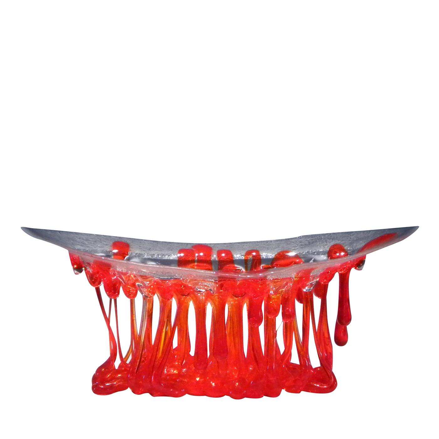 This stunning Murano glass sculpture is a gorgeous piece that can be displayed in any home or office space with a modern decor. The transparent, glass top of this piece is reminiscent of a boat, with the curved structure being upheld by bright red