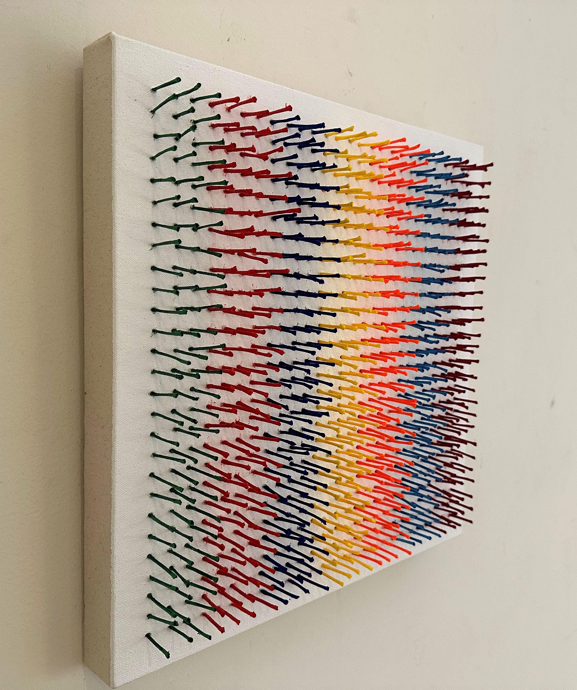 Abstract, sculptural, colorful artwork with strands of yarn piercing canvas For Sale 1