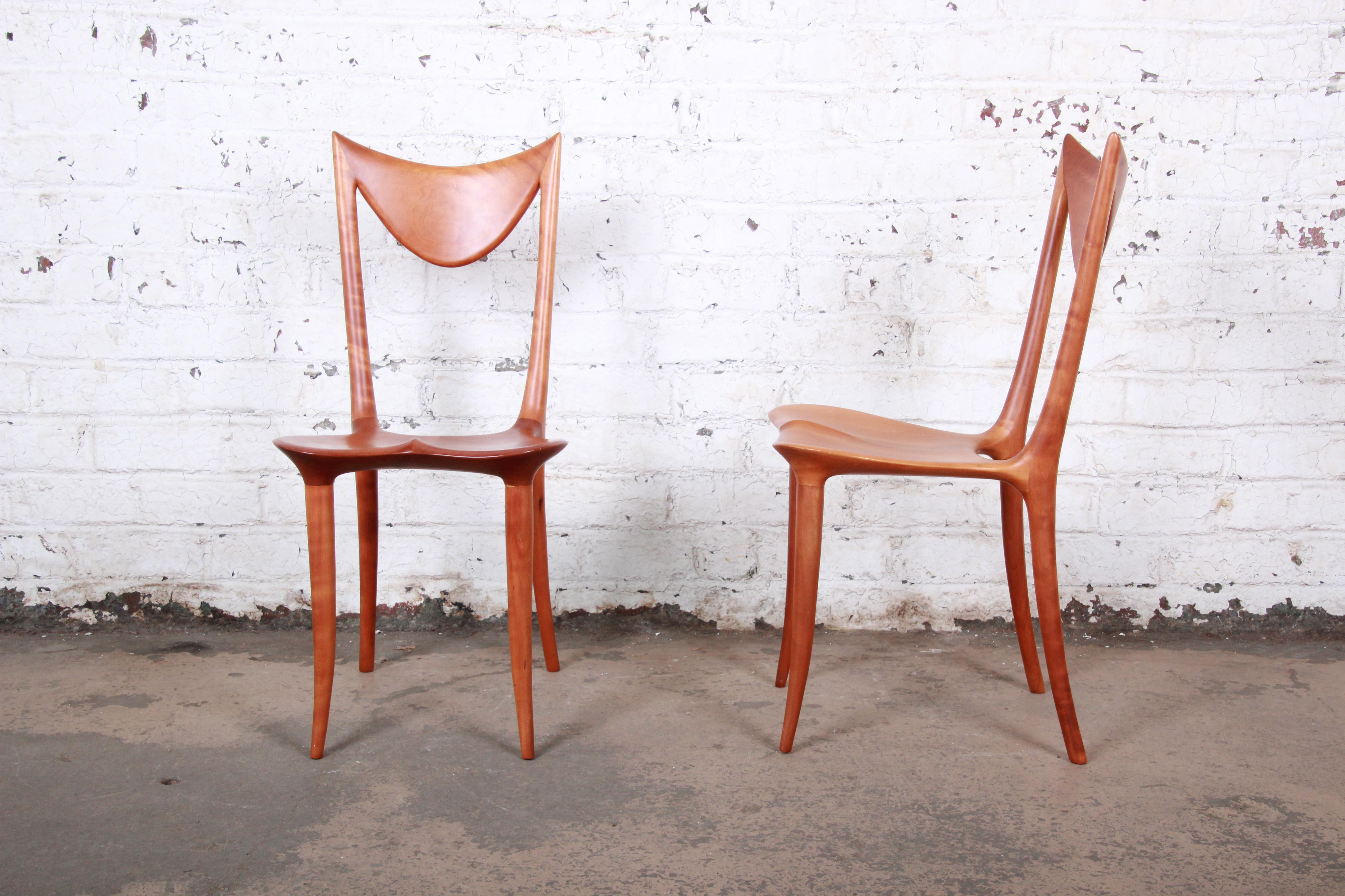 A rare and exceptional pair of studio craftsman sculpted chairs by world-famous Slovenian Industrial designer and artist Oskar Kogoj. These sculpted solid cherrywood chairs, known as 