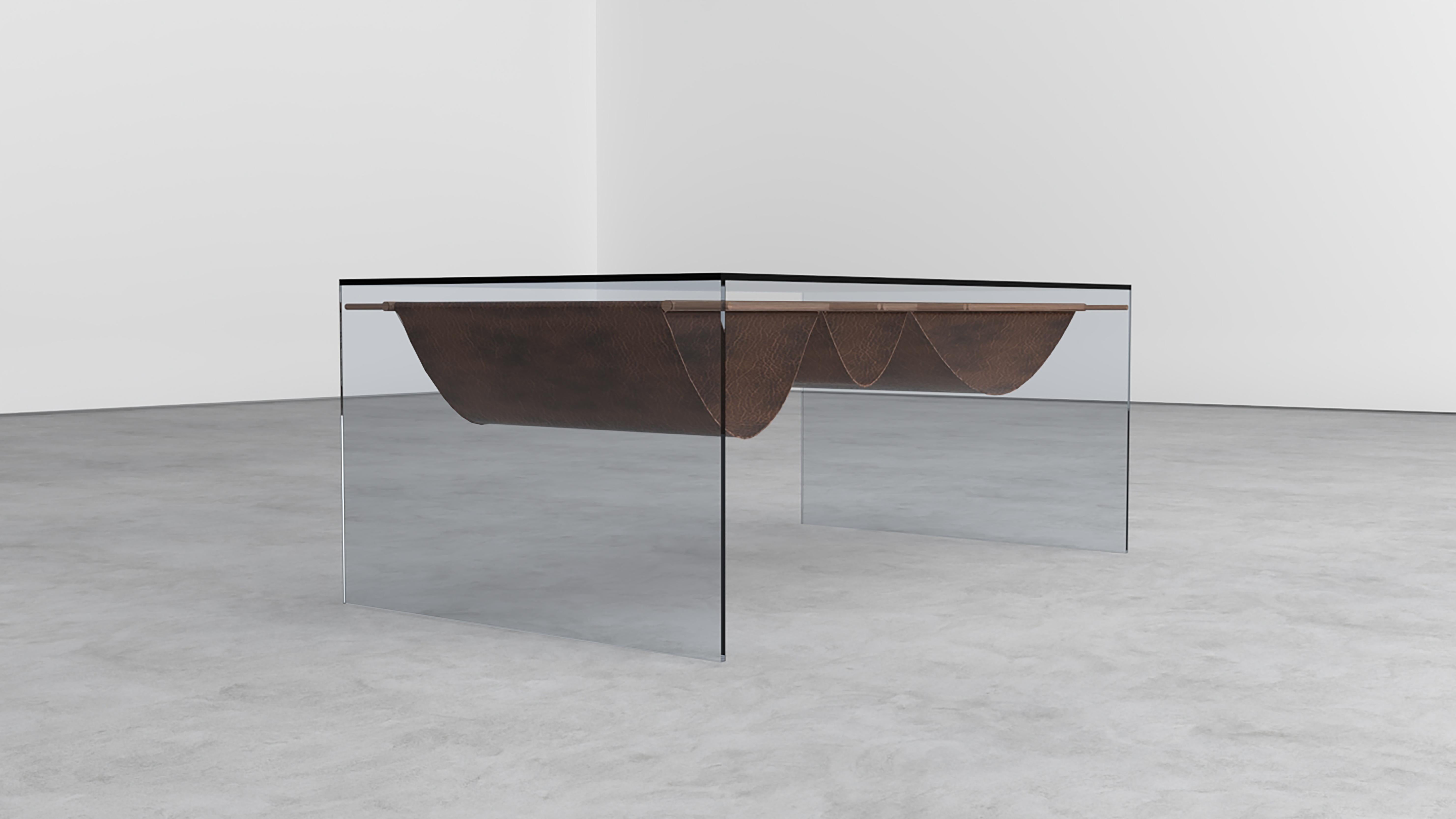 Oslo coffee table by Shou.
Dimensions: W 100 x D 60 x H 42 cm.
Materials: Tempered smoked glass, leather and wooden stick.

The coffee table is produced from the harmony of 8mm thick tempered smoked glass and 6mm thick polished wooden structure