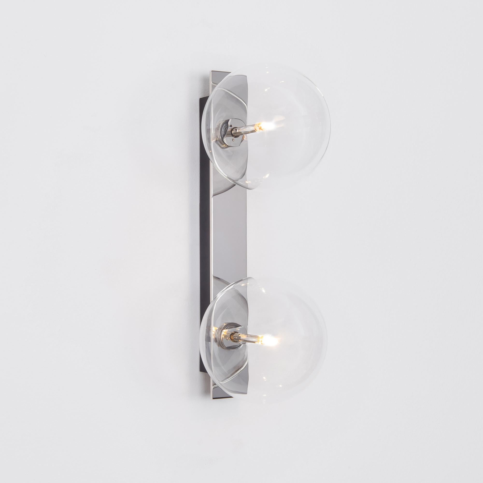 Oslo Dual wall sconce by Schwung
Dimensions: W 15 x D 19 x H 40 cm
Materials: Polished nickel, hand blown glass globes

Finishes available: Black gunmetal, polished nickel, brass
Other sizes available

Schwung is a German word, and loosely