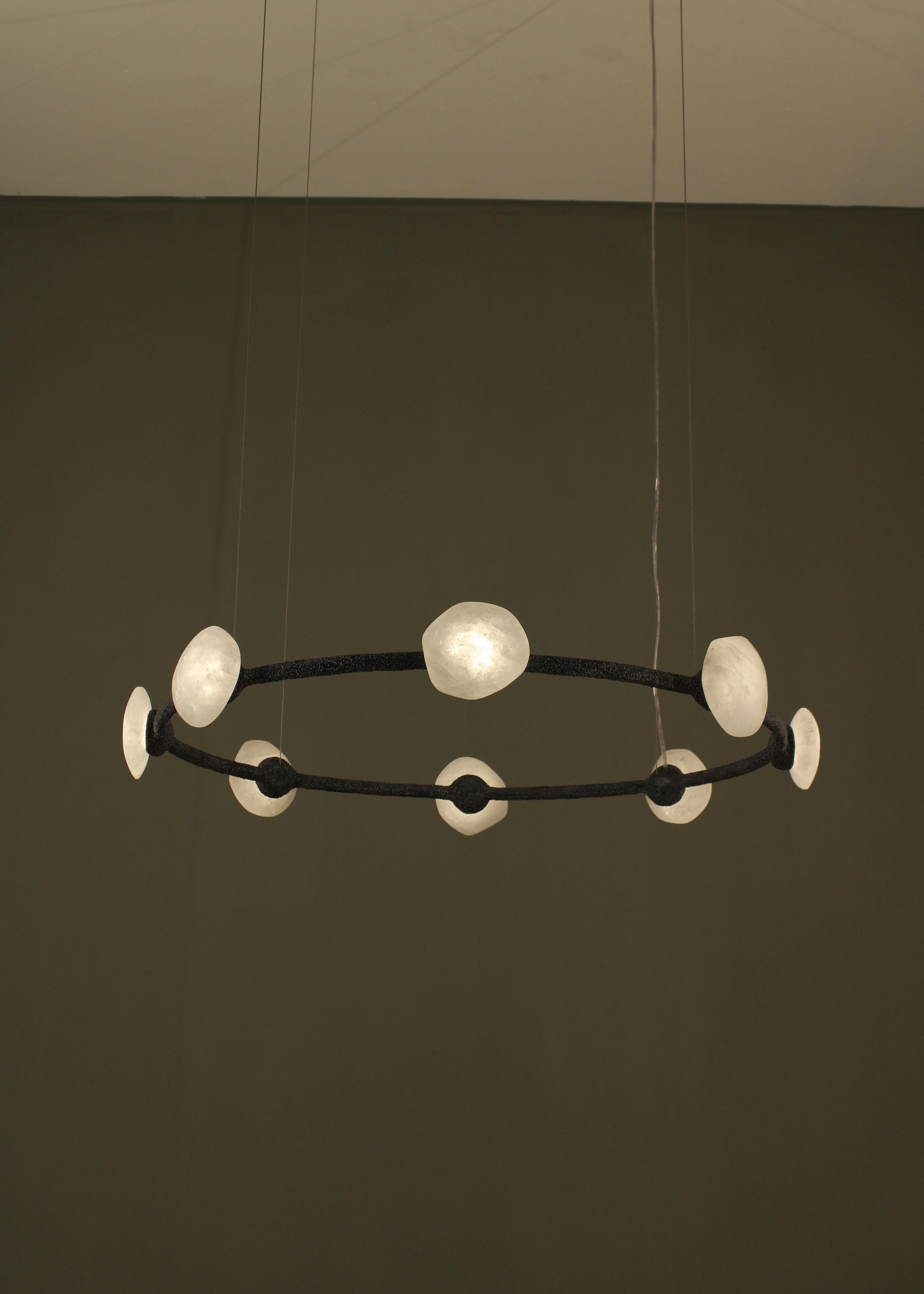 Oslo I Pendant Lamp with White Quartz And Hand-Blown Glass Details by Aver
Dimensions: D 86 x W 86 x H 13 cm.
Materials: Smoked glass, white quartz, and metal.

Available in different finishes. All our lamps can be wired according to each country.