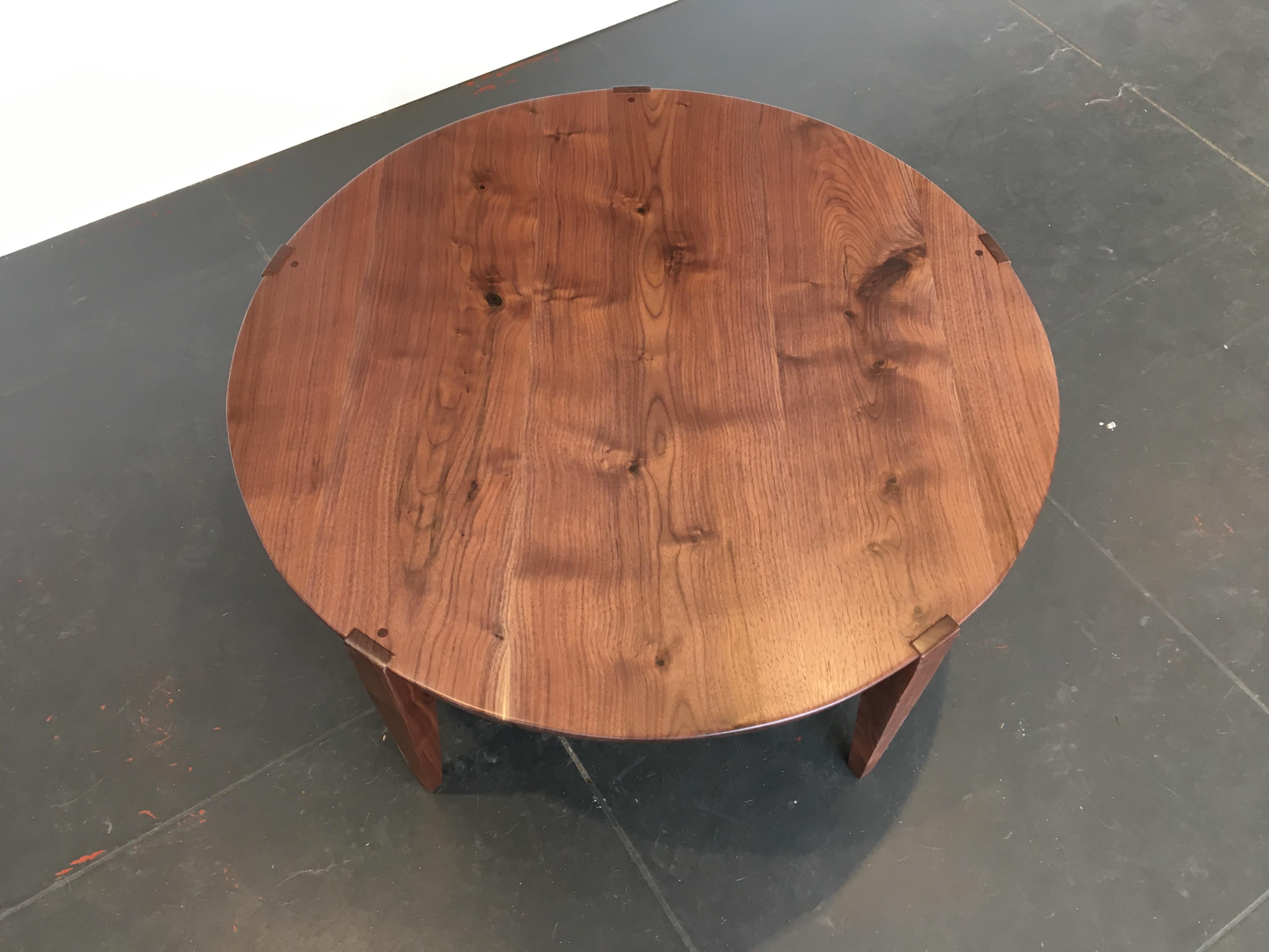 Simplicity and function converge in the Oslo round coffee table. This essential addition to your living room or lobby will keep foot traffic flowing more smoothly. Featuring our signature beveled edge tabletop, notched joinery, and finished with our