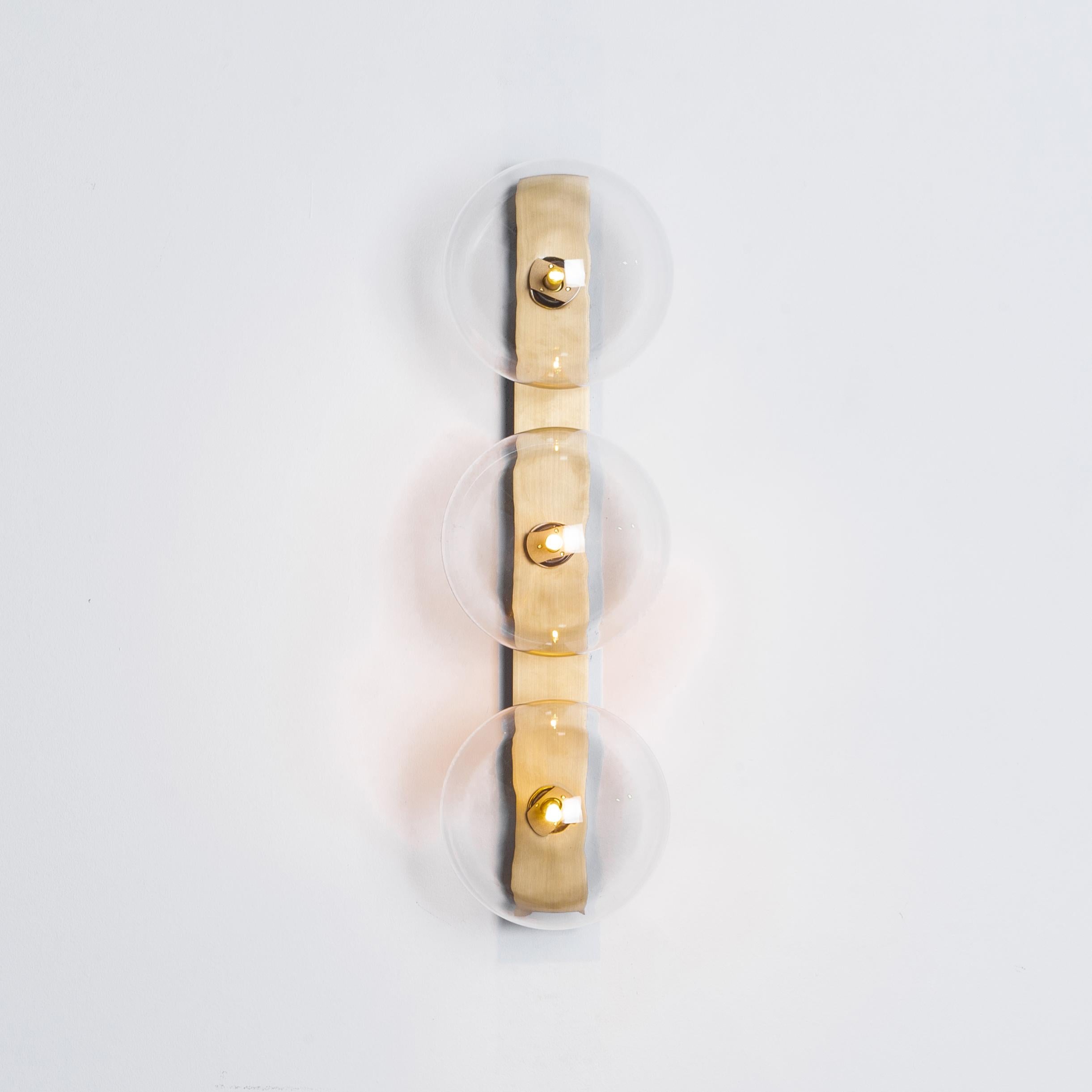 Oslo Triple brass wall sconce by Schwung
Dimensions: W 15 x D 19 x H 50 cm
Materials: Solid brass, hand blown glass globes

Finishes available: Black gunmetal, polished nickel, brass.
   

 Schwung is a german word, and loosely defined, means