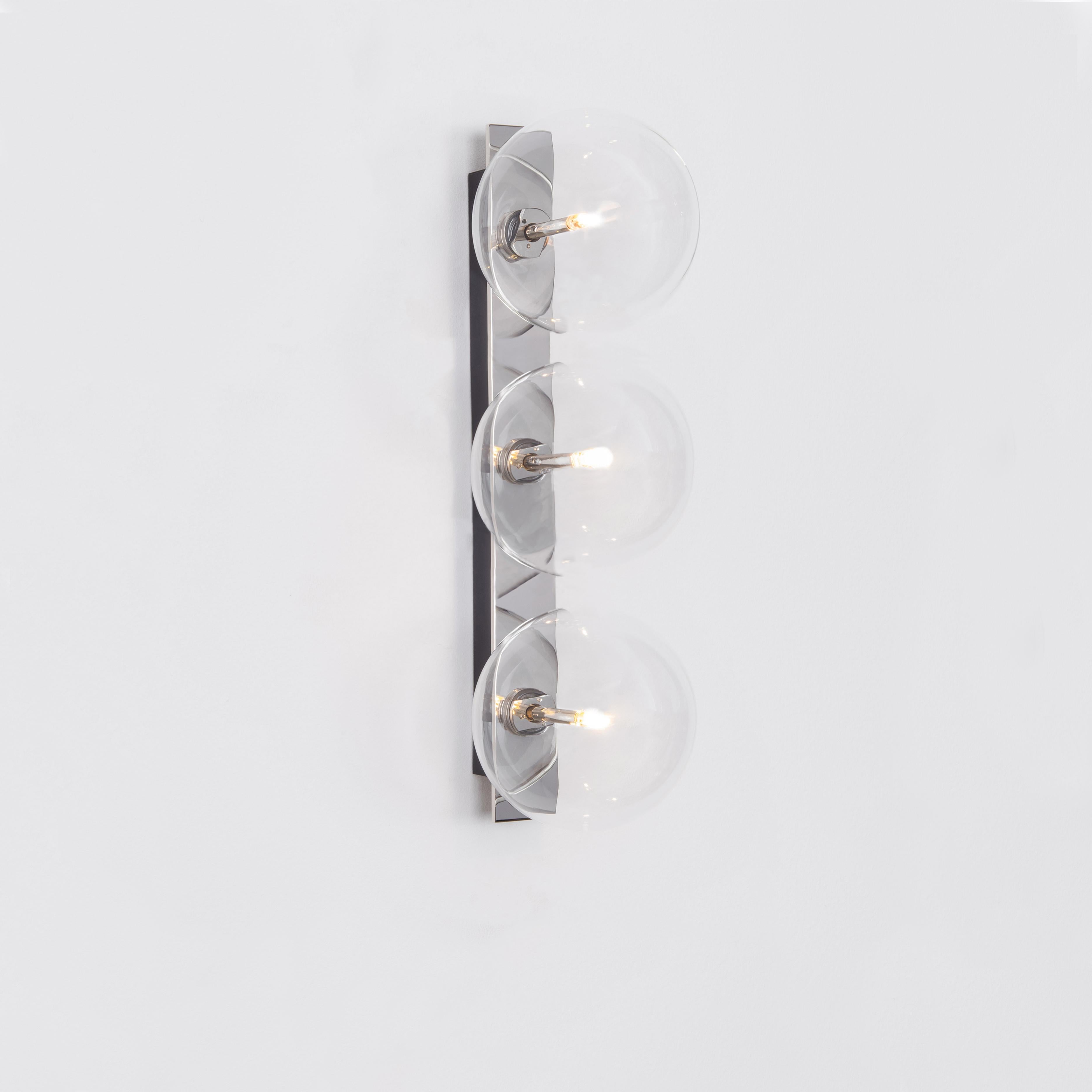 Oslo Triple Wall Sconce by Schwung
Dimensions: W 15 x D 19 x H 50 cm
Materials: Polished nickel, hand blown glass globes

Finishes available: Black gunmetal, polished nickel, brass


 Schwung is a german word, and loosely defined, means