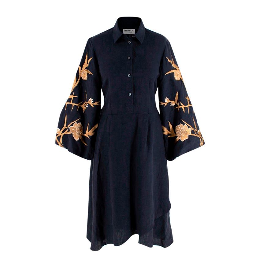 Osman Ariana Navy Linen Embroidered Shirt Dress
 

 - Navy line shirt dress with front button up closure, pointed collar
 - Intricate gold-tone embroidery on the wide sleeves 
 - Self-tie waist belt 
 - Asymmetric hem
 

 Materials:
 100% Linen 
