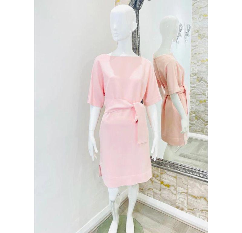 Osman Crepe Belted Dress

Baby pink with over sized self tie waist and side vents.

Additional information:
Size – 10UK
Composition- 52% Acetate, 45% Viscose, 3% Elastin
Condition – Good (Faint makeup line to inner neckline)
