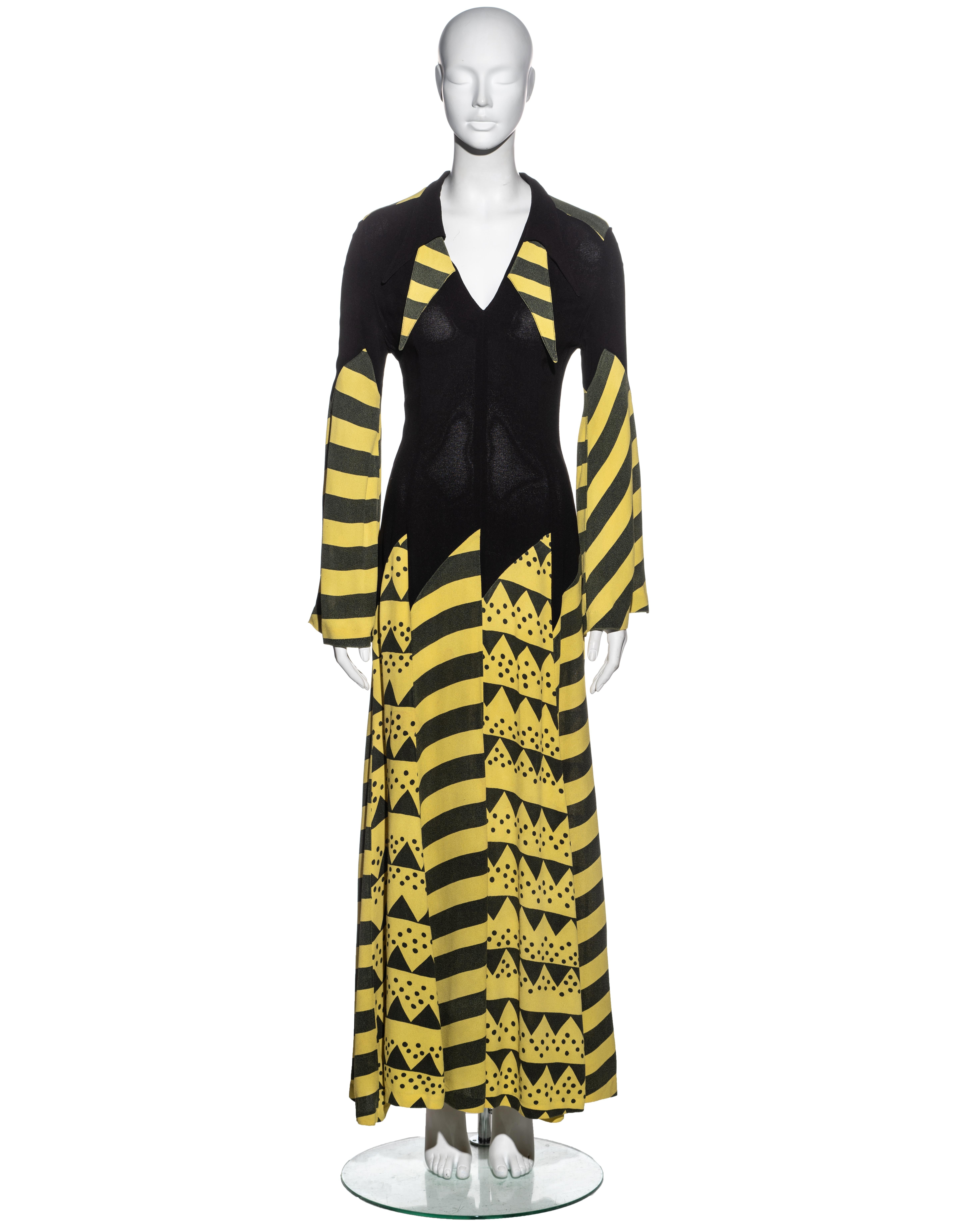 ▪ Ossie Clark black and yellow moss crepe maxi dress
▪ Print by Celia Birtwell 
▪ Trumpet sleeves 
▪ Skirt of multiple panels with pointed edges at hip
▪ Collar with four pointed lapels 
▪ Metal zip fastening at centre-back 
▪ Size Medium
▪