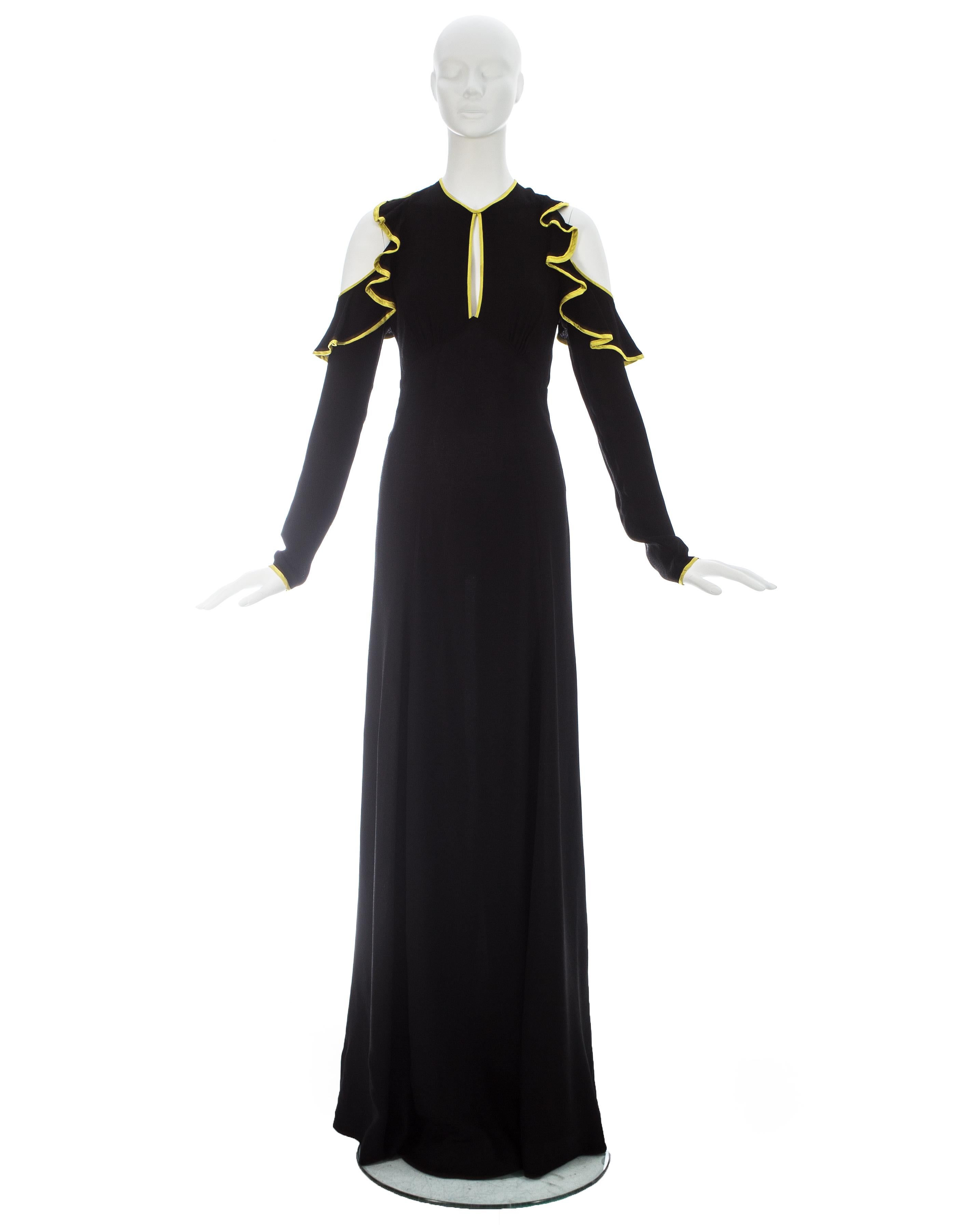 Black moss crepe 'Judy' dress edge in yellow satin with flounced cold shoulders and peek-a-boo cleavage

ca. 1970