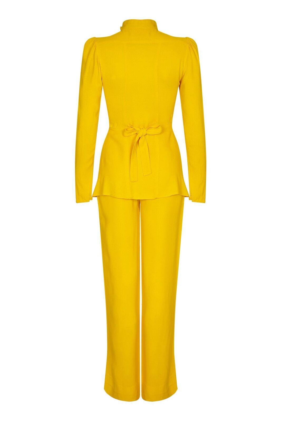 This exuberant 1970s moss crepe trouser set in canary yellow is by Ossie Clark for Radley, and showcases the designers celebrated flare for flowing lines and desirable silhouettes. Both separates are in super vintage condition and the colour has