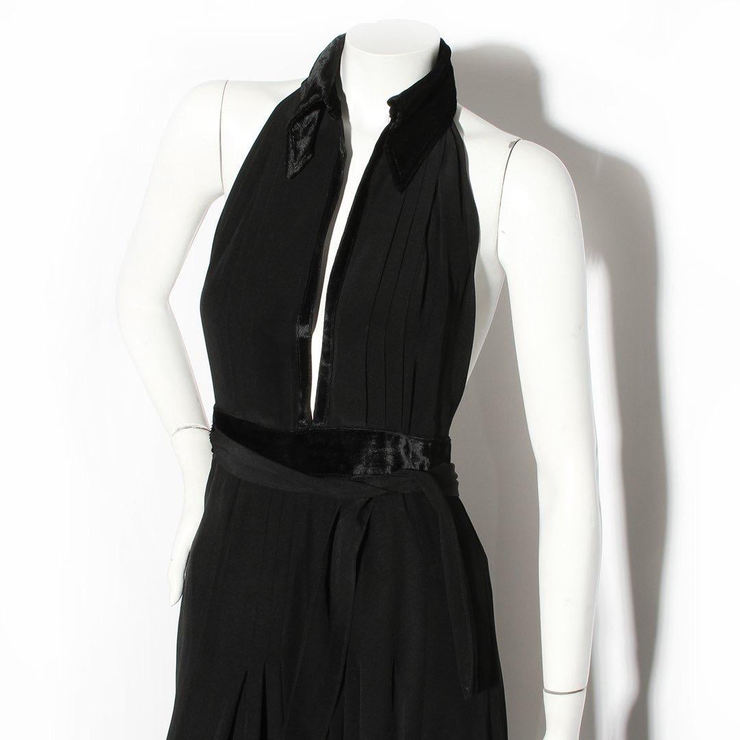 Vintage Ossie Clark Dress
Made in London, England
Black 
Halterneck with pleating along bust
Black velveteen peak collar
Black velveteen empire waist detail
Two ties wrap around from the back through a keyhole in the waist to tie as desired
Full
