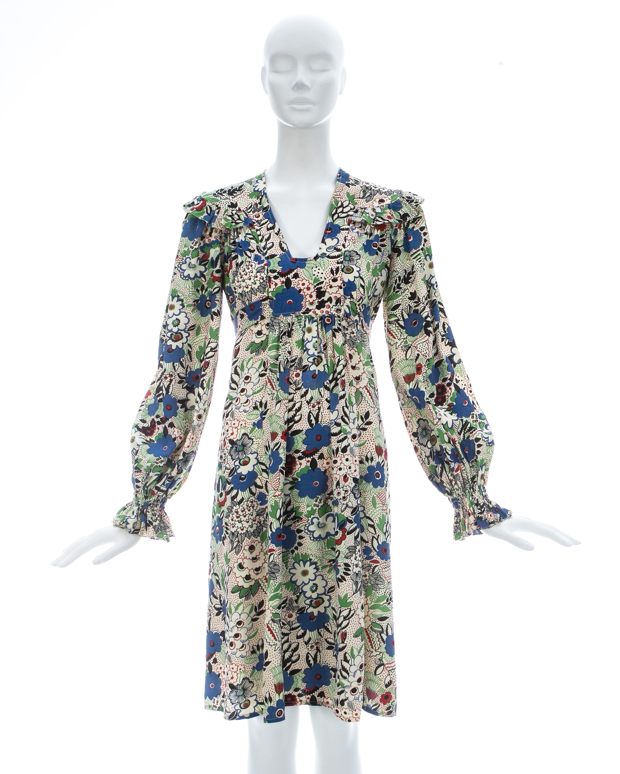 Ossie Clark; Below the knee dress with 'Pretty Woman' print by Celia Birtwell in shades of blue, green and red, smock-style with ties at the waist, and shirred cuffs

ca. 1970