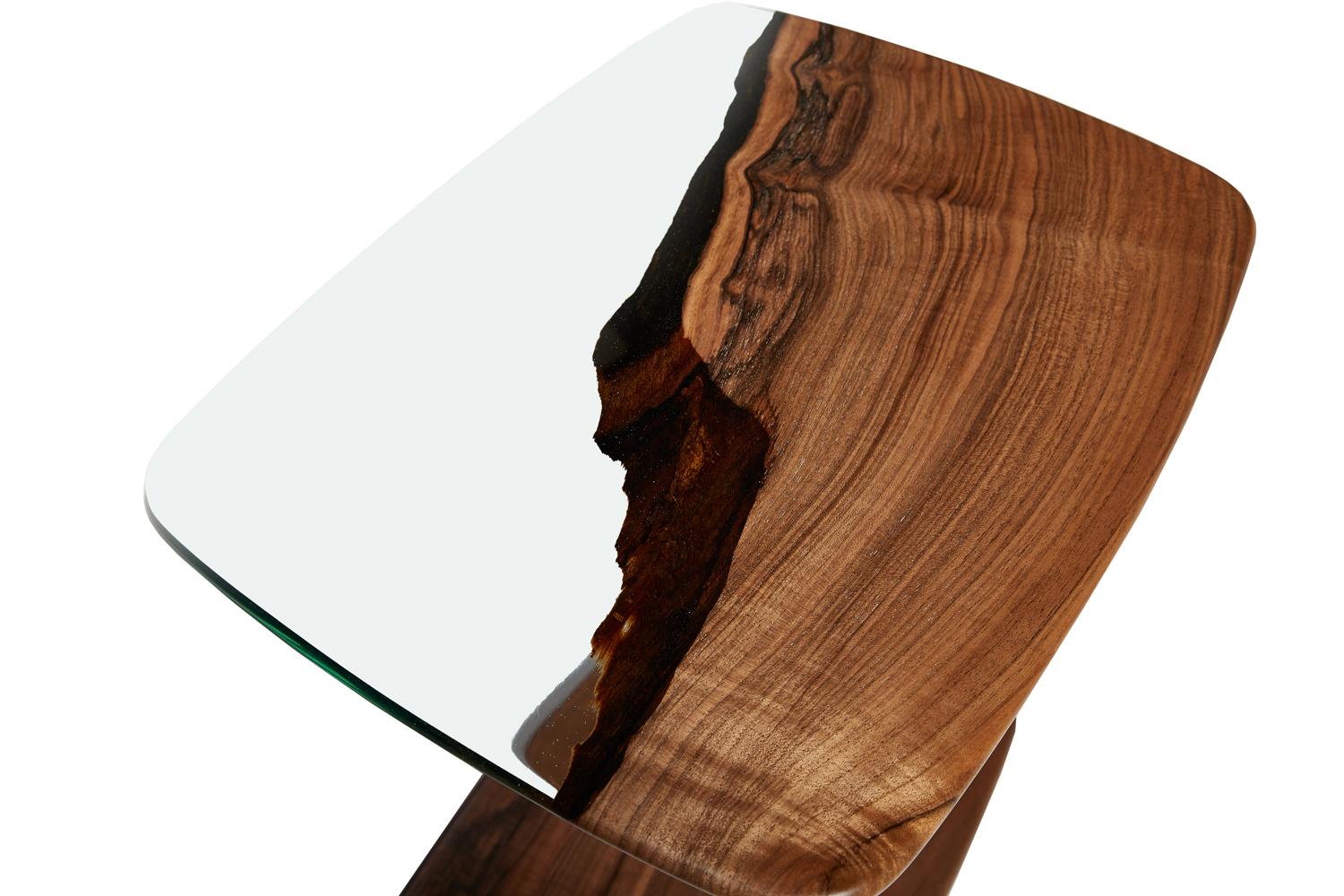 Walnut and resin easy glide end and coffee table by Naturalist.

This clear epoxy resin c-table is made with walnut wood. The creamy tones of the wood add a perfect biophilic feel to any space, while our exclusive ultra clear resin adds its modern