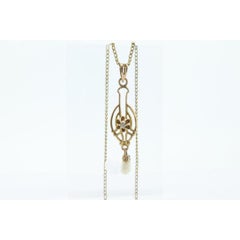 Ostby Barton Diamond pendant lavaliere. 10k Gold with a diamond set buttercup