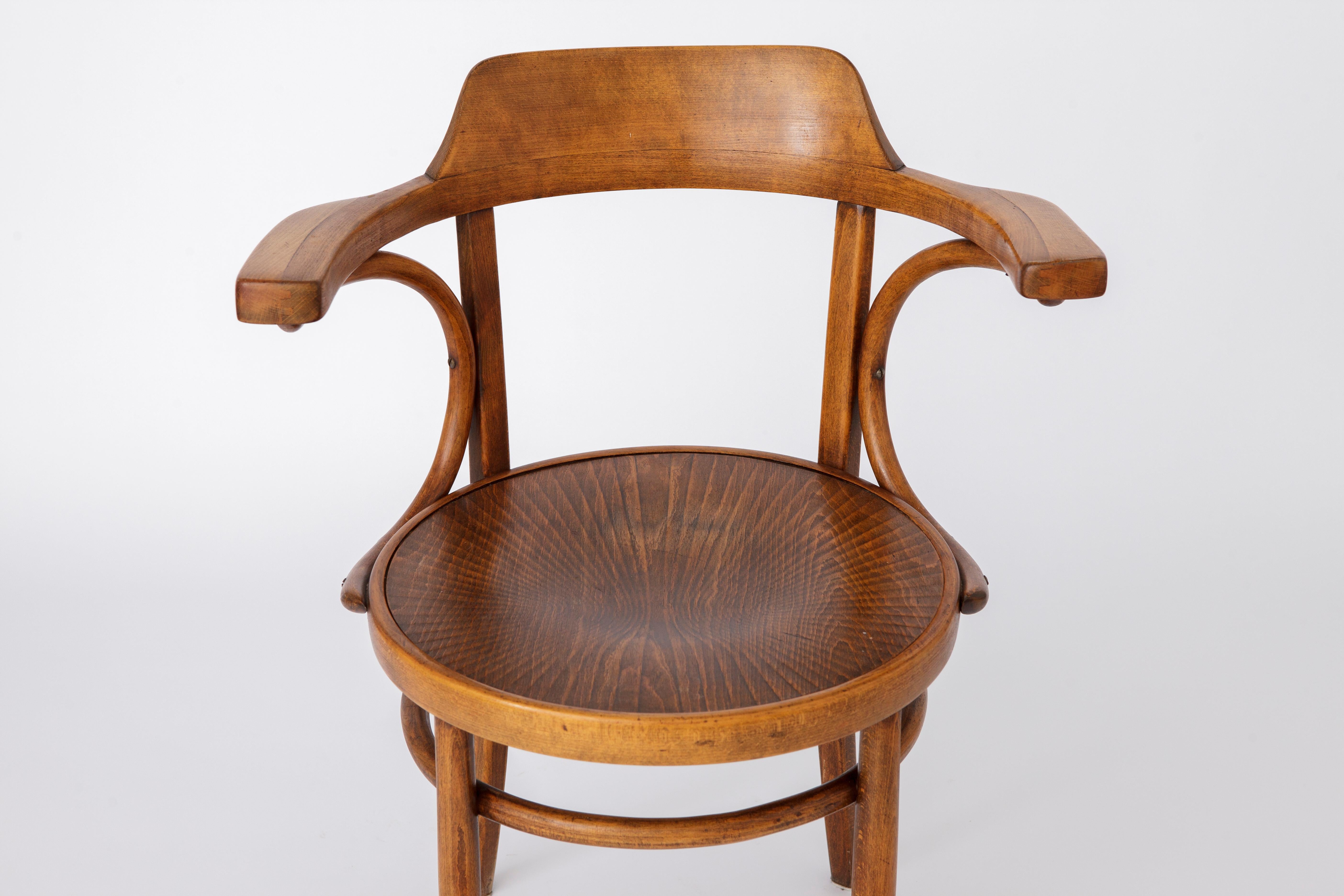 Coffee Vintage Armchair made of bentwood. 
Origin: Austria. Production period: approx. 1950s. 

Good vintage condition. Stable dyed beech wood frame. 
No cracks or former repairs in the wood. 
Not marked. 