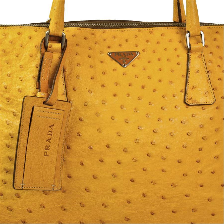 Real ostrich Ochre color Two handles Zip closure With locker and keys Internal zip pocket Internal textile Cm 50 x 32 x 21 (19.6 x 12.5 x 8.2 inches)
