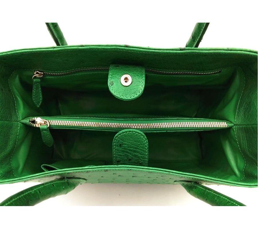 Real ostrich leather Green color Double handle Double compartment Internal zip pocket Leather lining Internal pockets and phone holder Removable shoulder strap Cm 30 x 215 x 12 (11.8 x 8.46 x 4.72 inches) Artisanally made in Italy
