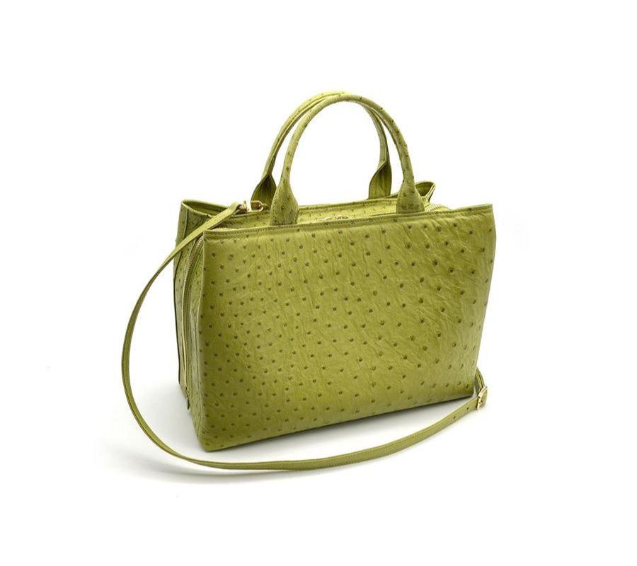 Real ostrich leather Pistachio green color Double handle Two side compartments with magnetic closure Central compartment with zip closure Leather or silk lining Internal pockets and phone holder Removable shoulder strap Cm 33 x 23 x 14 (12.99 x 9.05