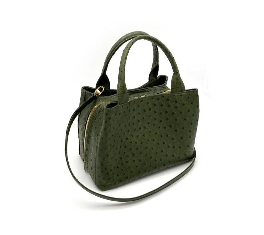 Real ostrich leather Forest green color Double handle Two side compartments with magnetic closure Central compartment with zip closure Leather or silk lining Internal pockets and phone holder Removable shoulder strap Cm 24 x 18 x 15 (9.44 x 7.08 x