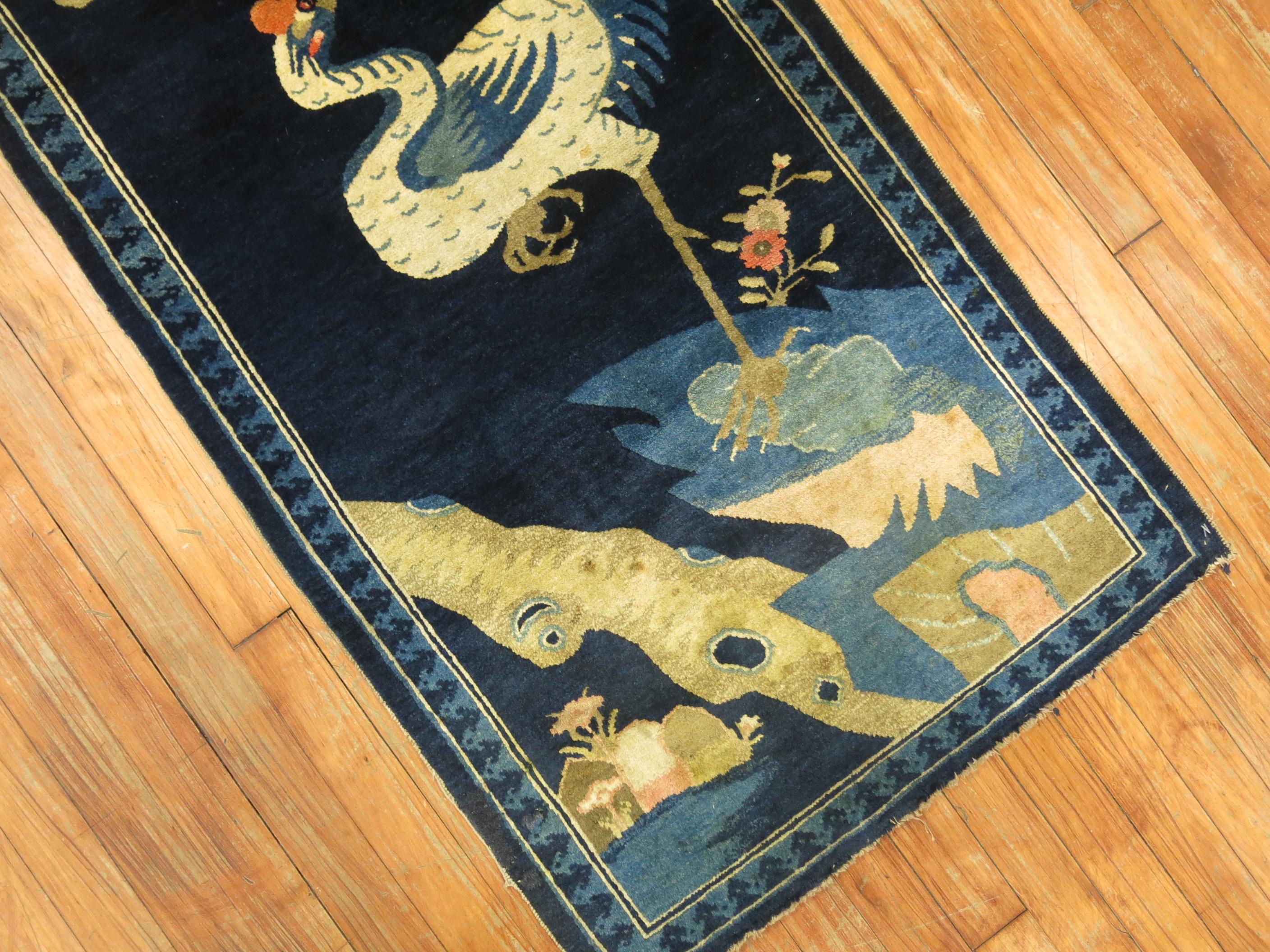 An early 20th century Chinese rug featuring a large ostrich on a deep midnight blue ground. The quality on this is quite Fine and has a medium pile throughout.