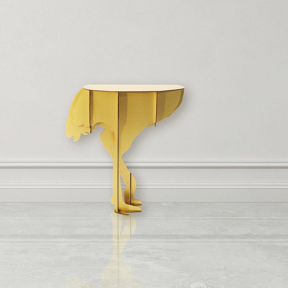 Diva, the aerial ostrich, appears poised to spread her wings in a daring dance, defying the laws of gravity with her feet that seem to barely touch the ground.

Designed to be mounted against a wall, this elegant console—both ornamental and