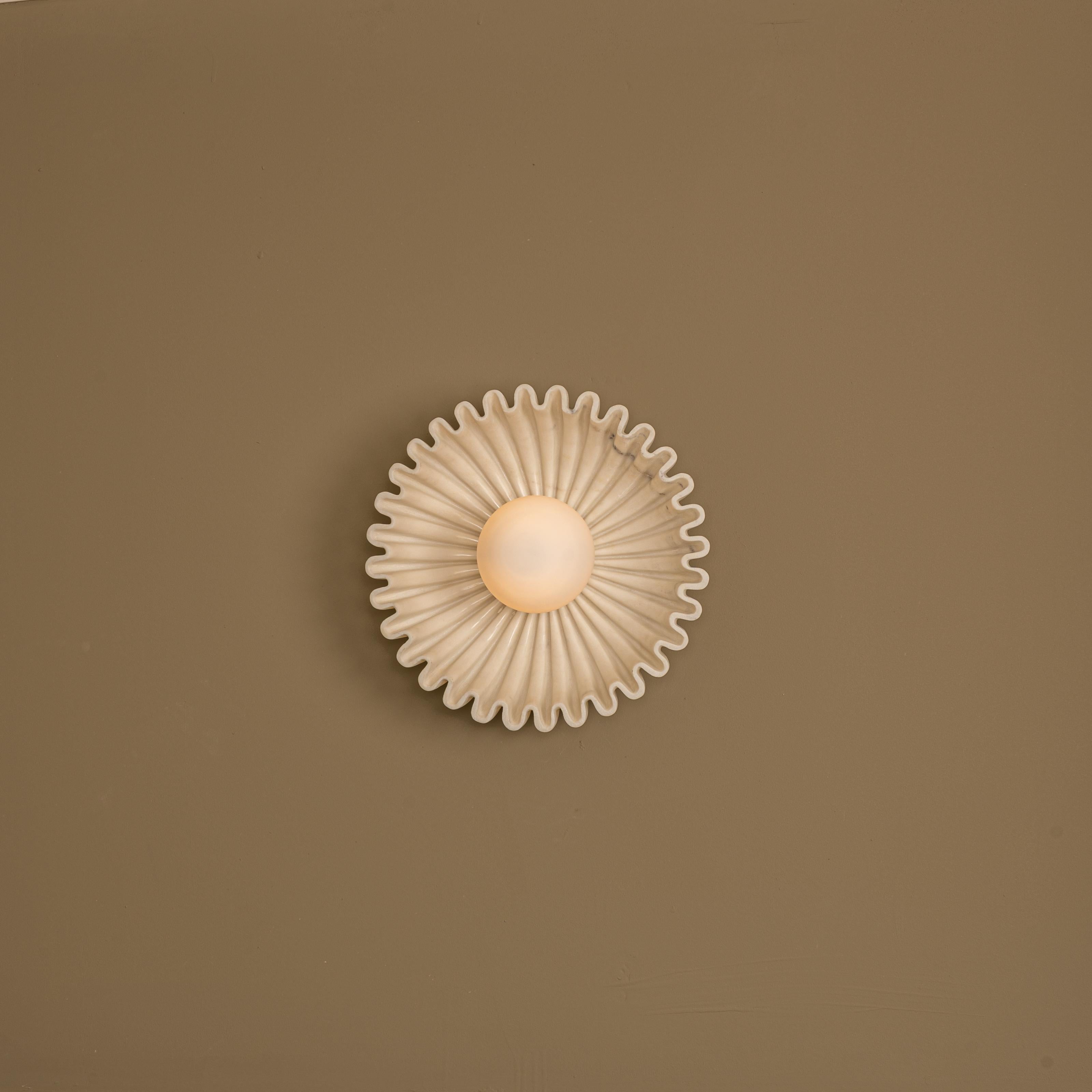 Ostro White Marble Wall Sconce by Simone & Marcel
Dimensions: D 15 x W 31 x H 31 cm.
Materials: Marble and glass.

Available in different ceramic and marble options and finishes. Custom options available on request. Please contact us. 

All our