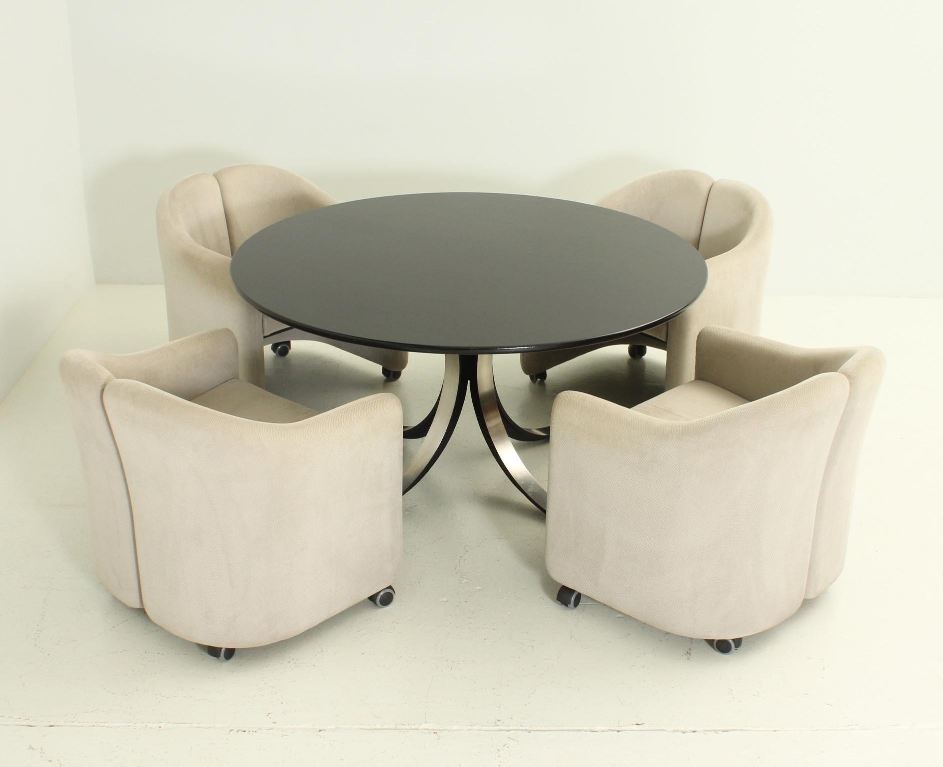 Dining or working set designed between 1966-69 by Osvaldo Borsani and Eugenio Gerli for Tecno, Italy. Composed of four PS142 armchairs and T69 table, the set was designed as a compact seating and surface system for working or eating. Table in
