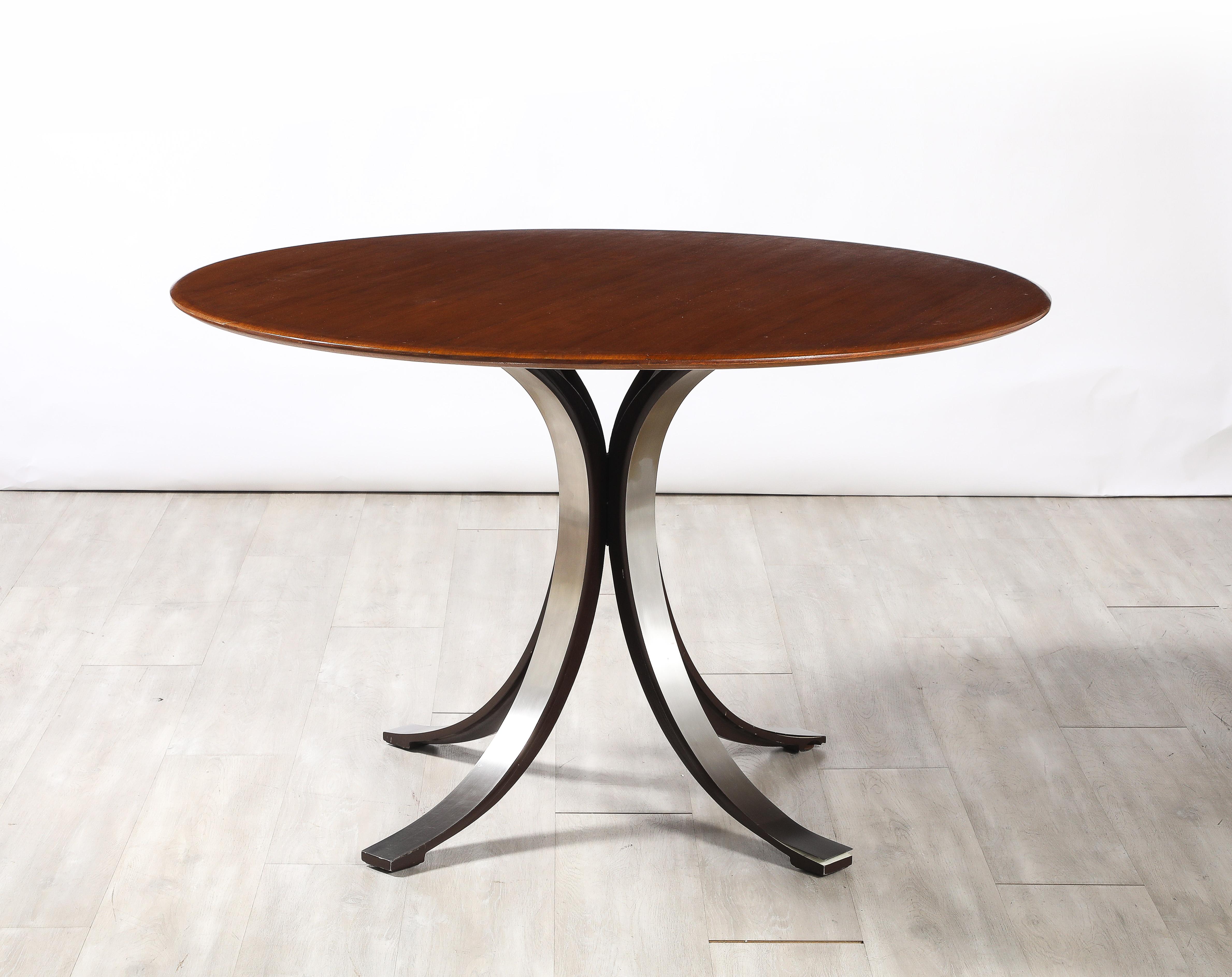 Osvaldo Borsani and Eugenio Gerli for Tecno, 'T69'  Circular Center or Dining Table, Italy, circa 1963. 

The circular center or dining table features a rich walnut top and a steel base which has a concave construction that conveys an organic