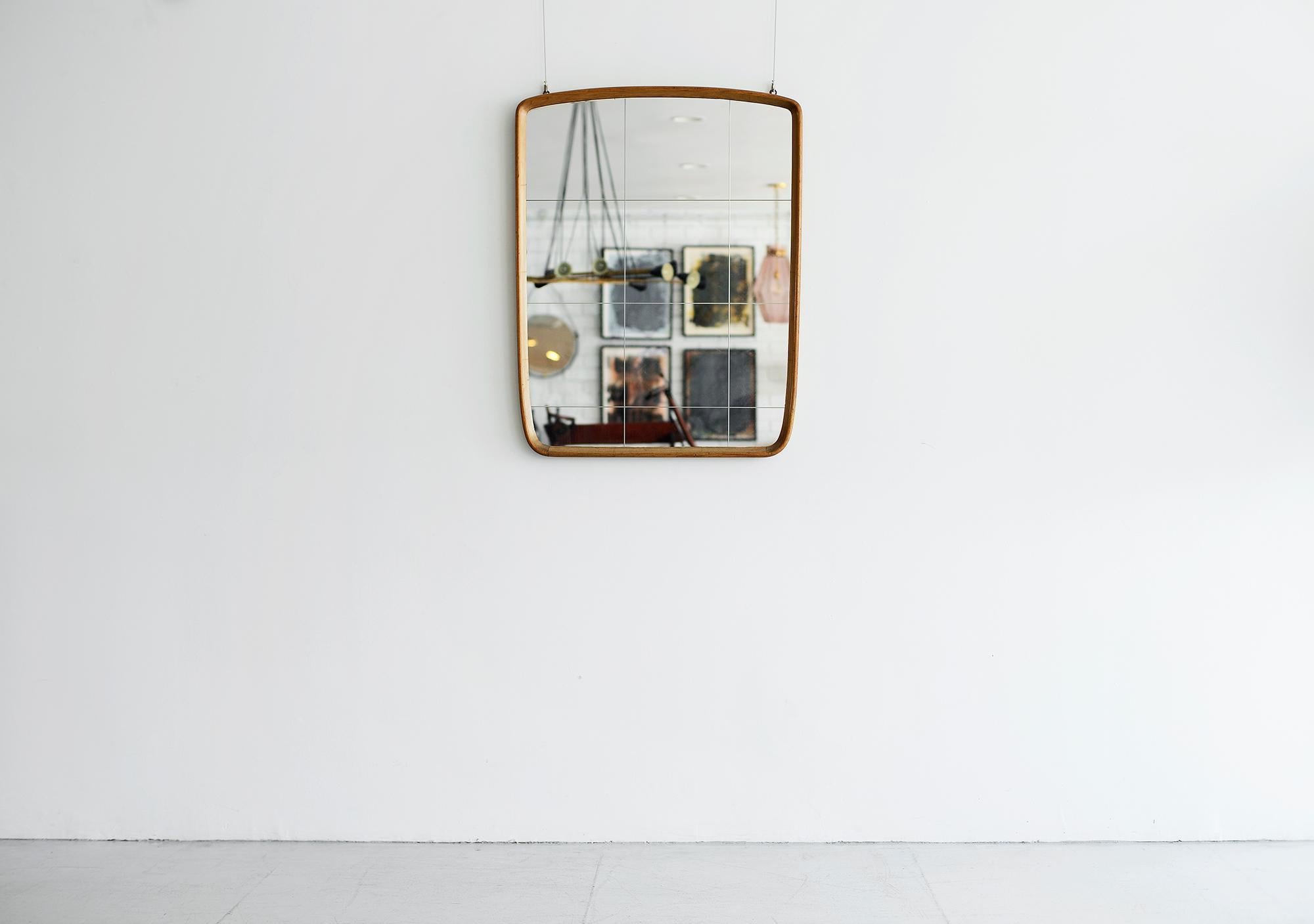 Fantastic Italian mirror attributed to Osvaldo Borsani.

Bevelled edged mahogany wood with original square panes of glass.
 