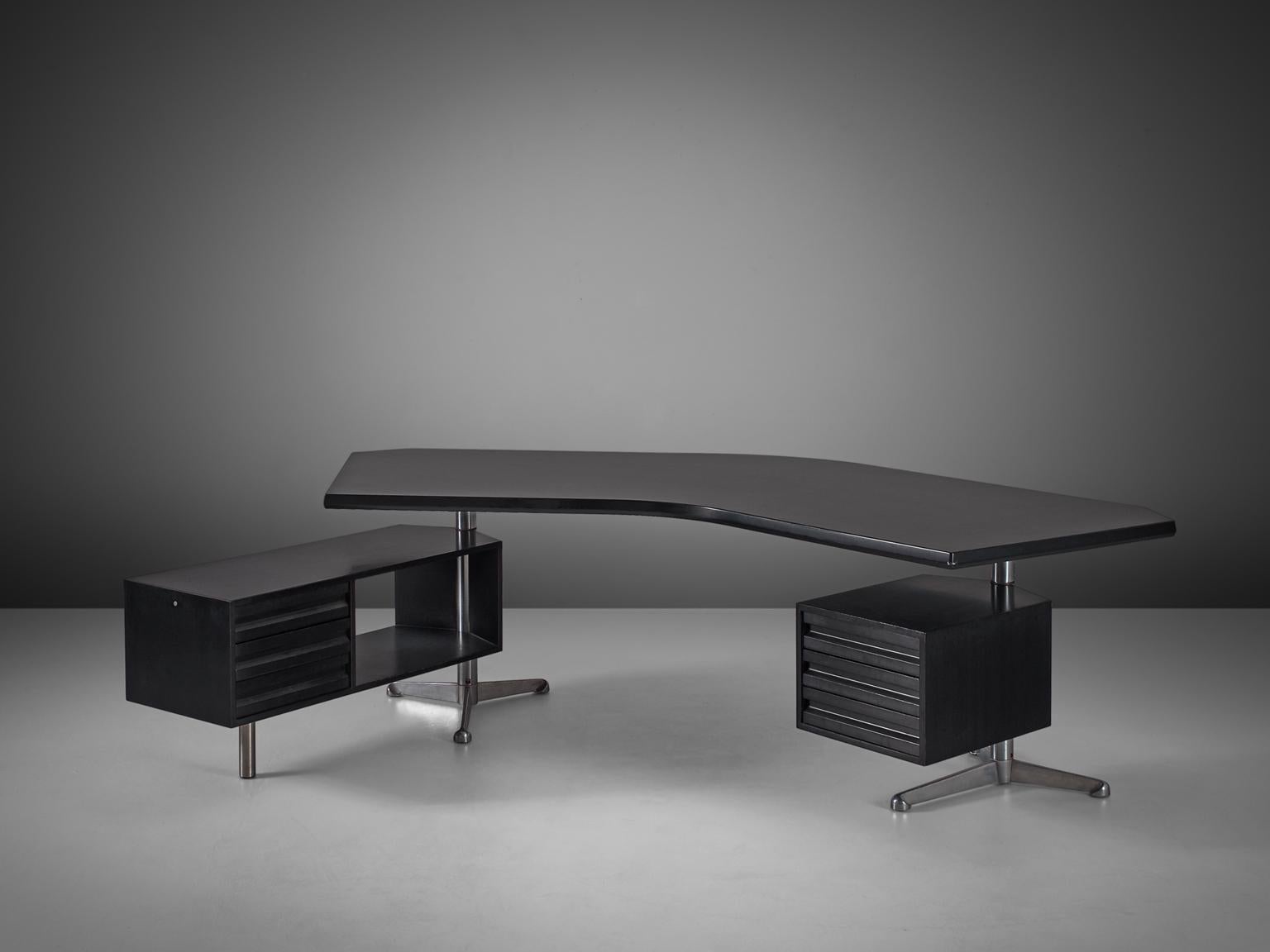 Desk T-96 'Boomerang', in wood and metal, by Osvaldo Borsani for Tecno, Italy 1956. 

A very nice black version of this well known design by Osvaldo Borsani. The two revolving cabinets are held in place by the characteristic stainless steel