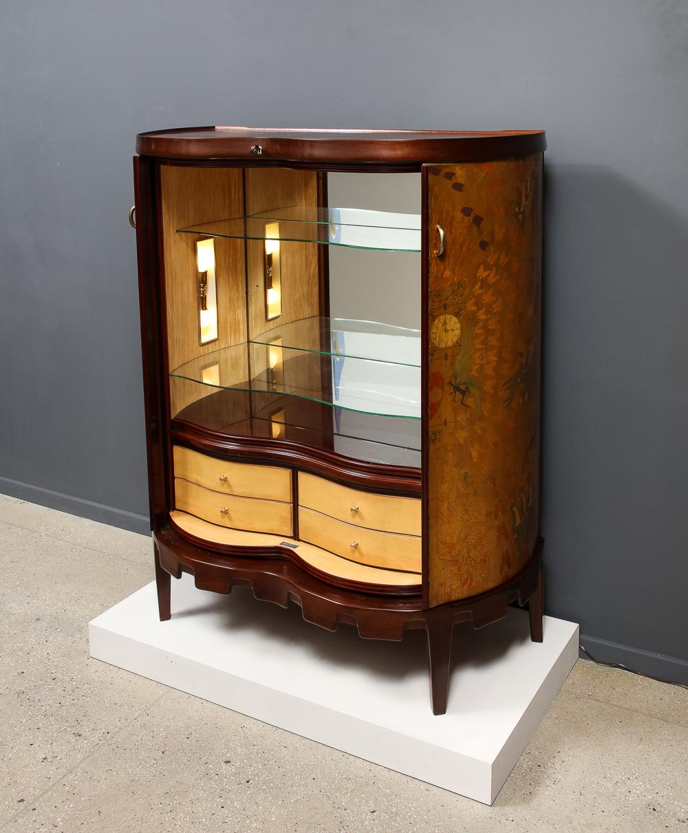Drinks Cabinet, Model No. 6534B by Osvaldo Borsani for ABV.  Mahogany, painted wood, maple, glass, brass. Arredamenti Borsani Varedo edition. This cabinet features 2 front doors that retract into the cabinet revealing a lit interior with mirrored
