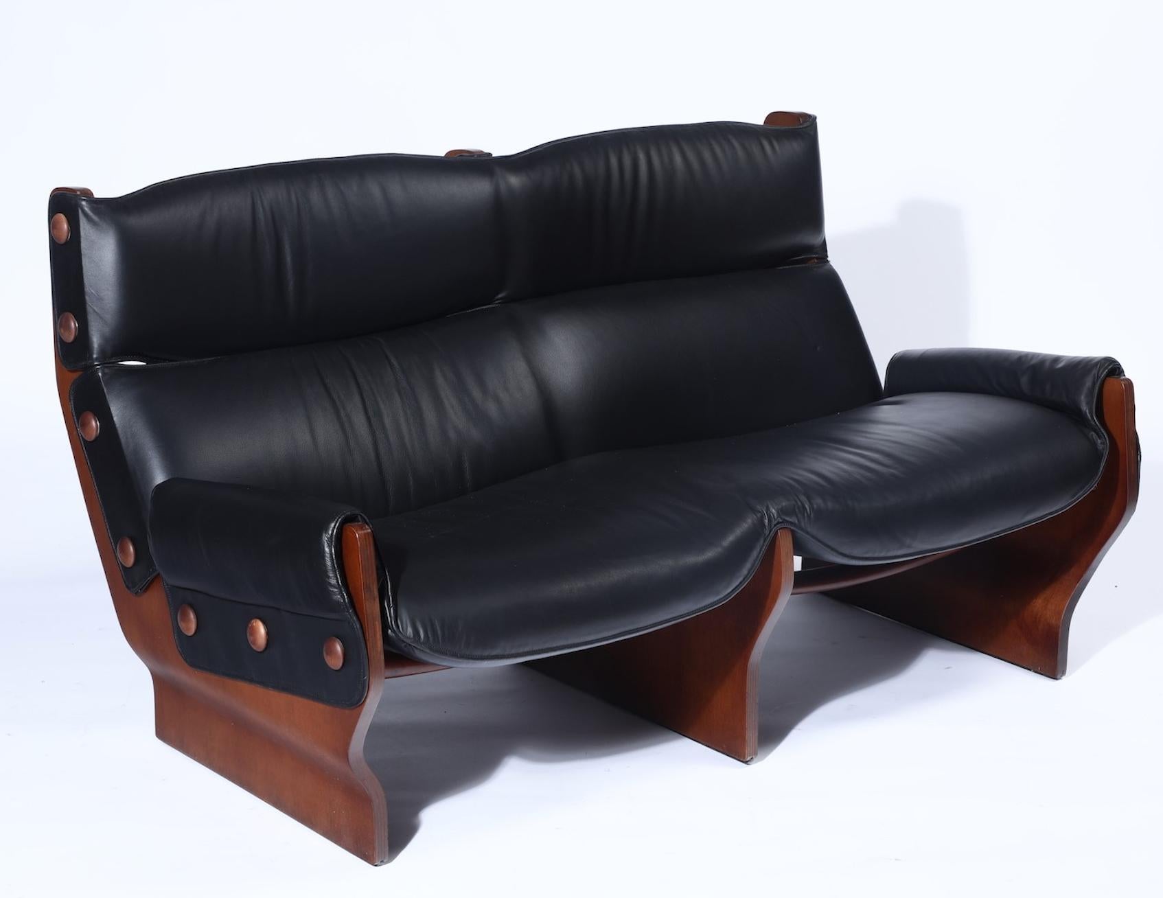 Osvaldo Borsani, a mod. Canada Sofa, Italy, 1960s. Wooden structure and black leather upholstery meticulously cared for and imported from Italy.