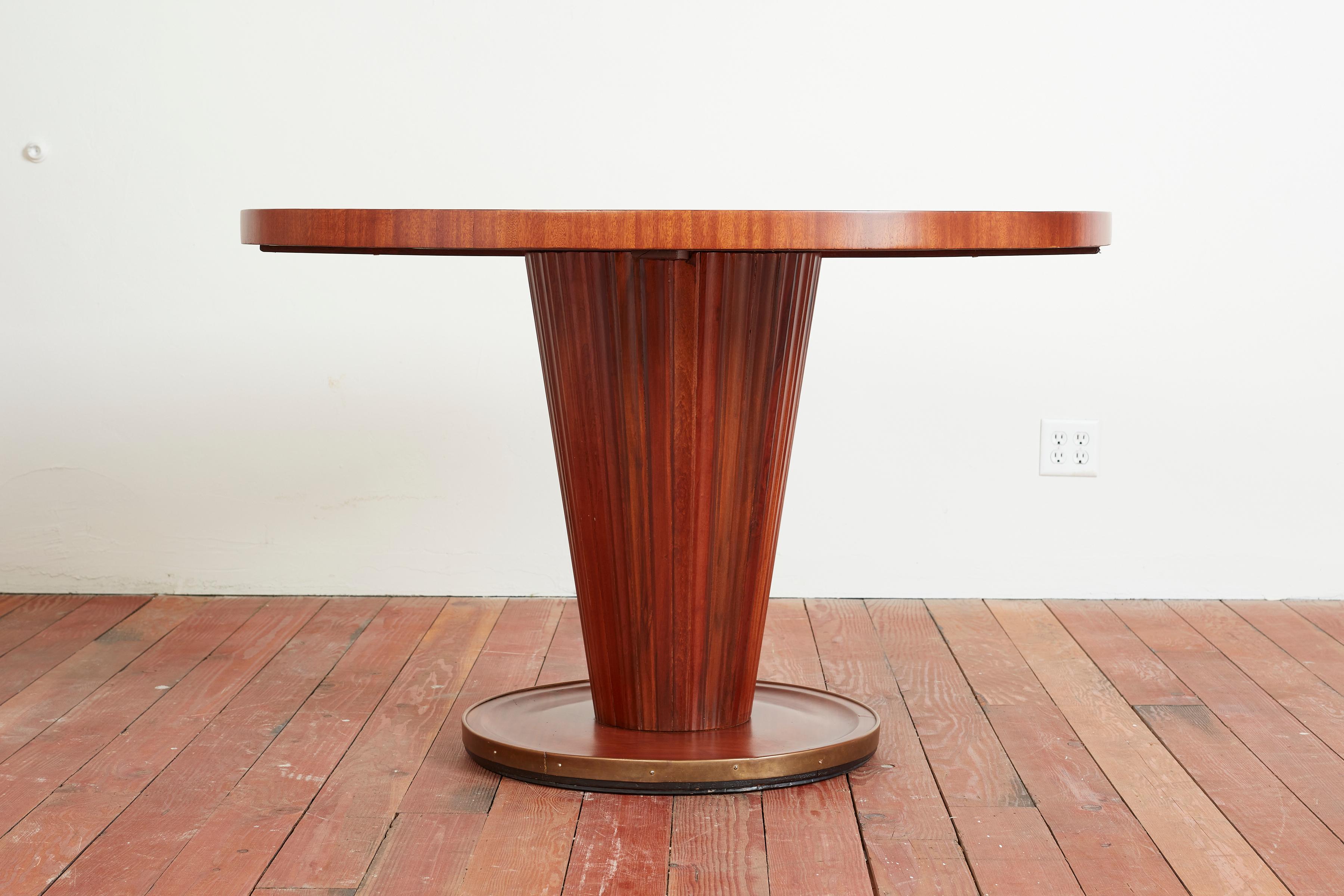 Important center table by Osvaldo Borsani - Italy, circa 1950s
Stunning inlayed walnut top with corrugated pedestal base with brass detail. 
Newly refinished and restored - 
Exquisite piece!