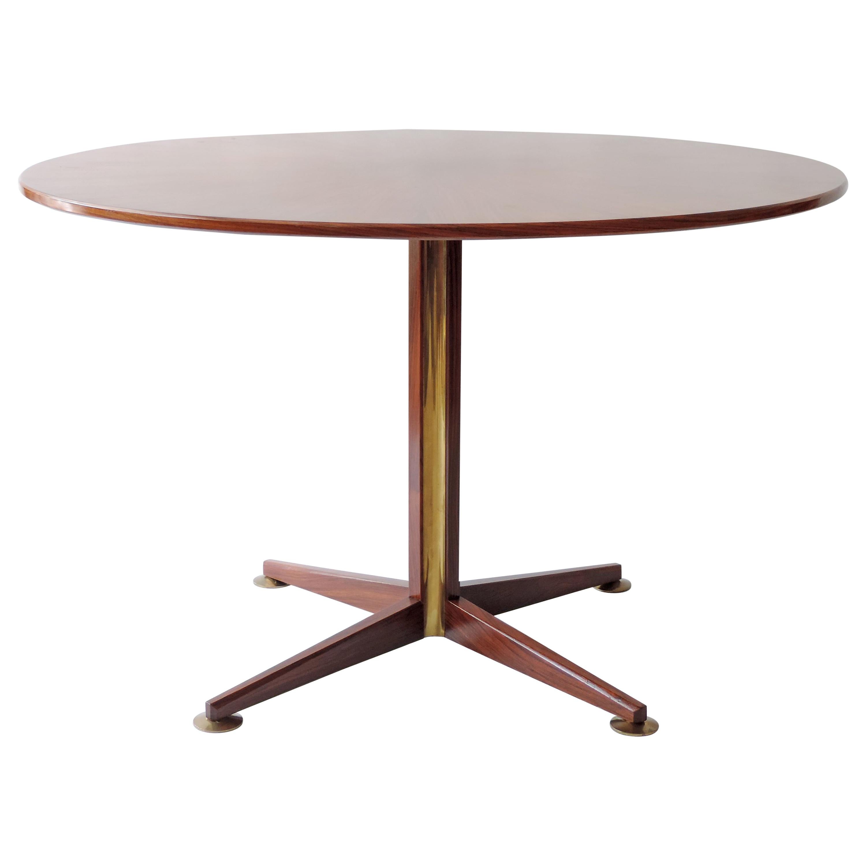 Osvaldo Borsani circular dining table in wood and brass details, Italy, 1960s